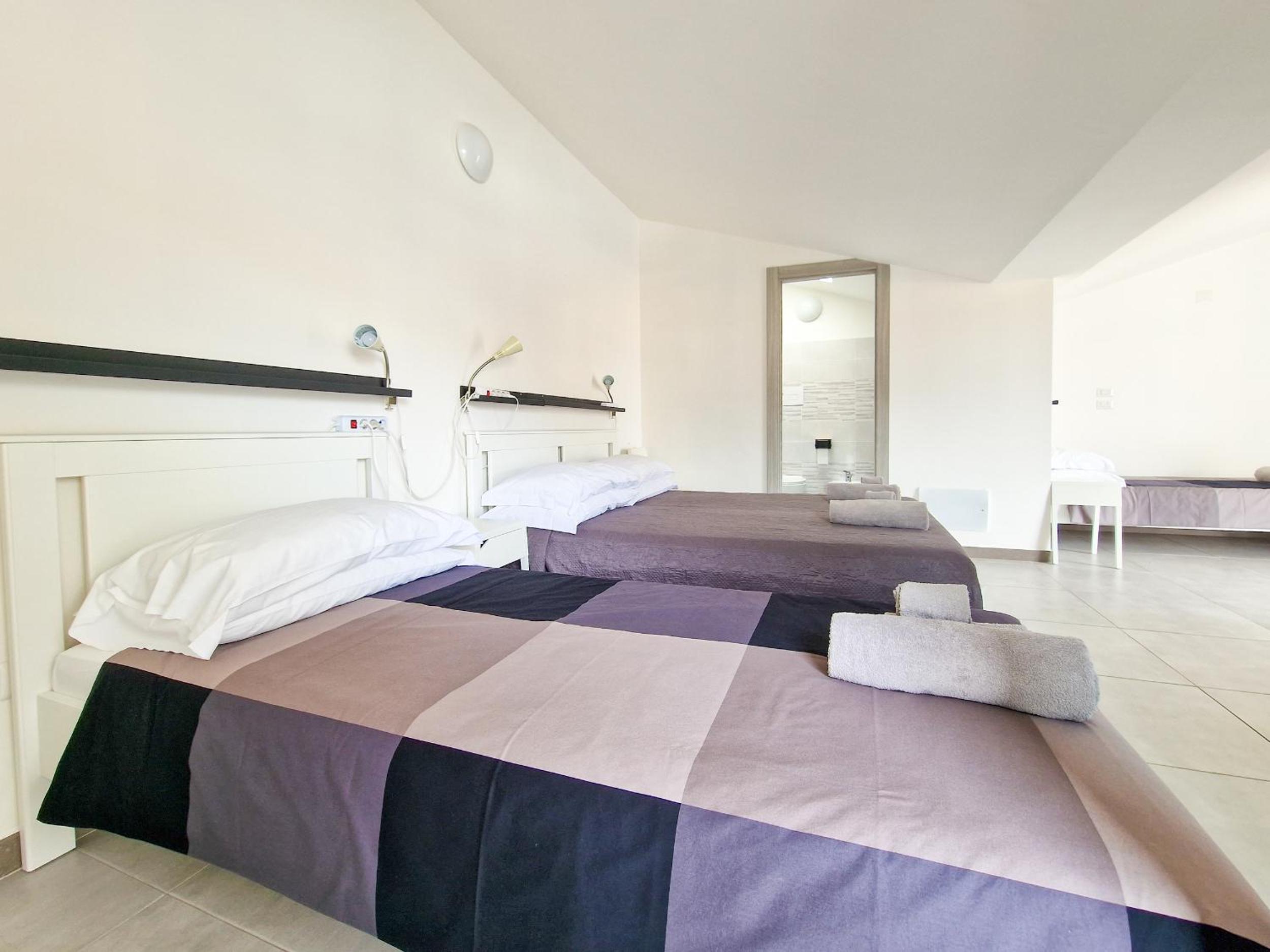Deluxe Quadruple Room - Photo 19