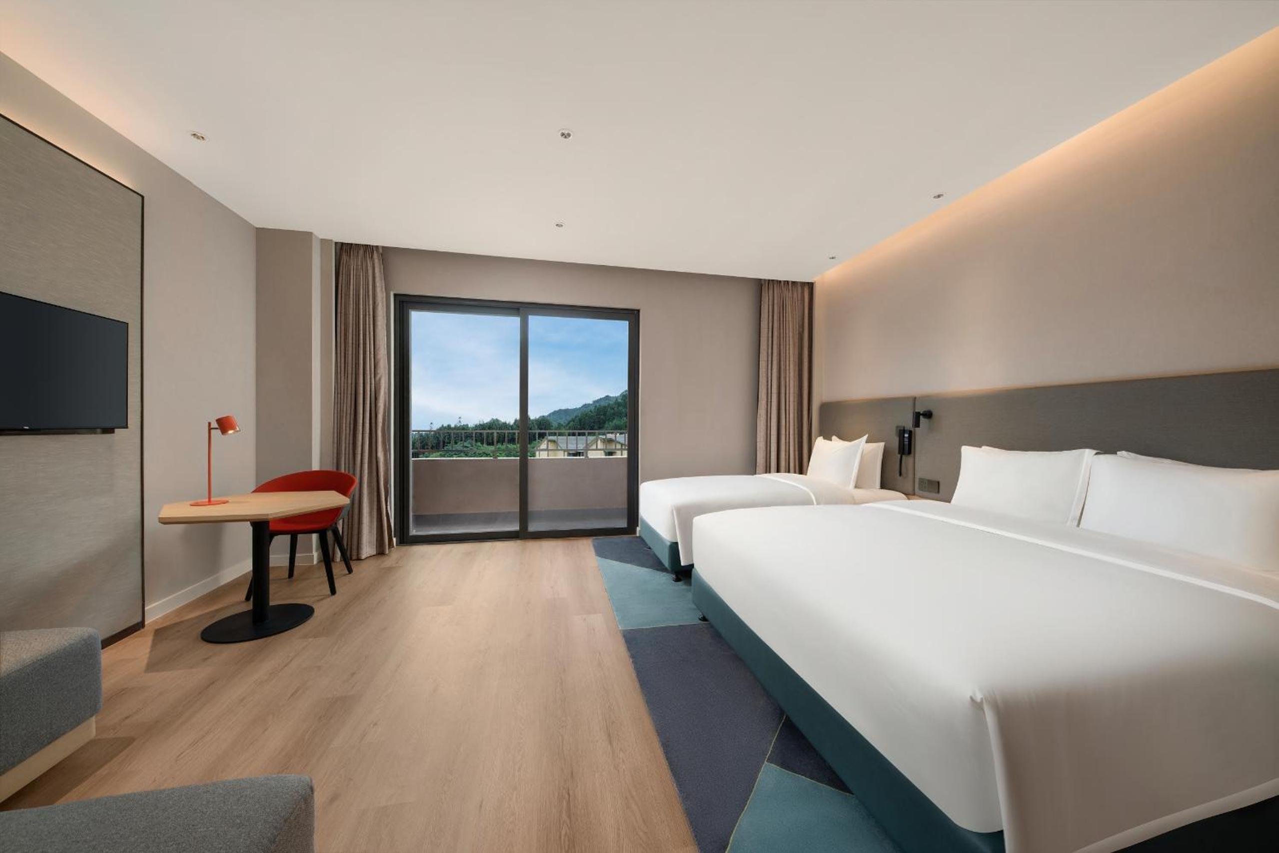 Standard Room with One King, One Single Bed and Balcony