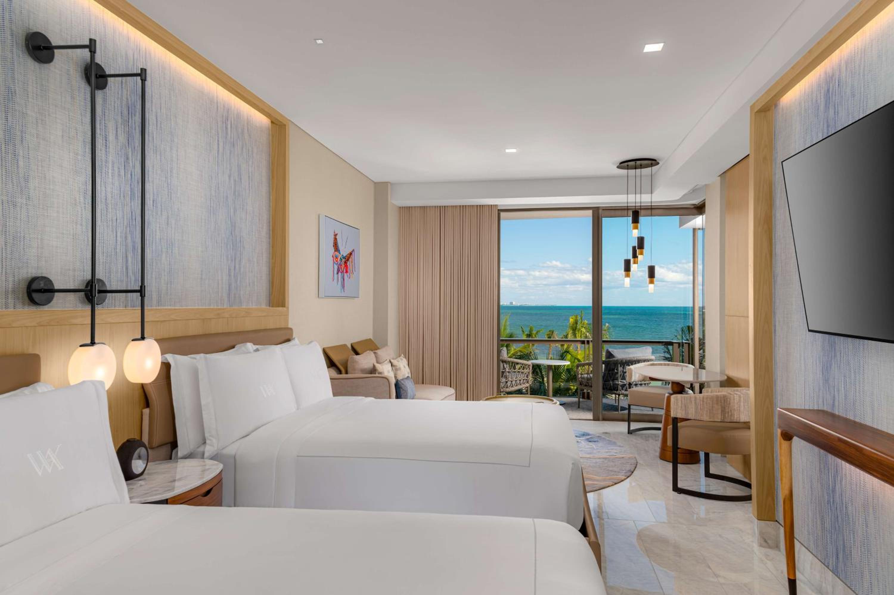 Habitación frente al mar con dos camas Queen