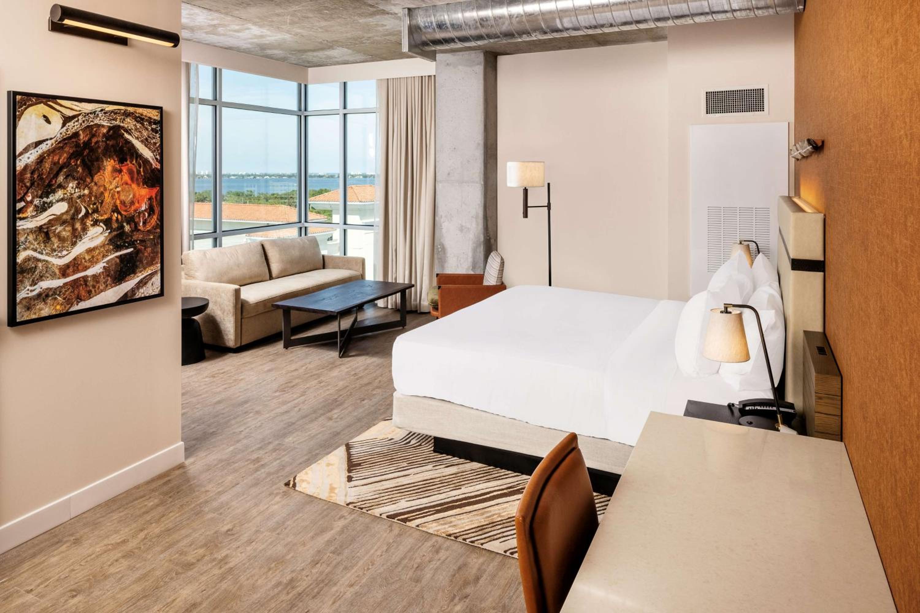 Corner King Room with Sofa and Water View - Photo 1