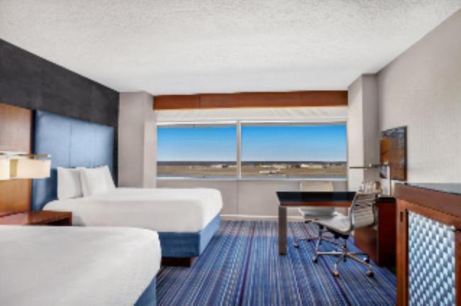 Queen Room with Two Queen Beds and Runway View - Photo 1