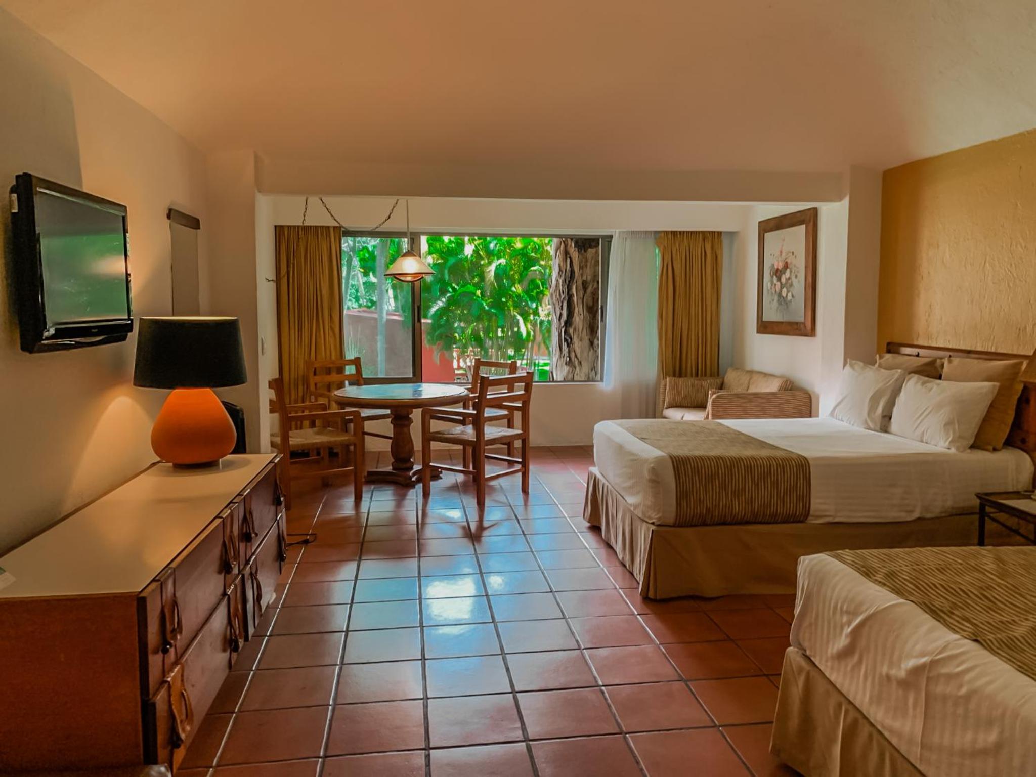Quarto Duplo com Duas Camas de Casal com Vista para o Jardim