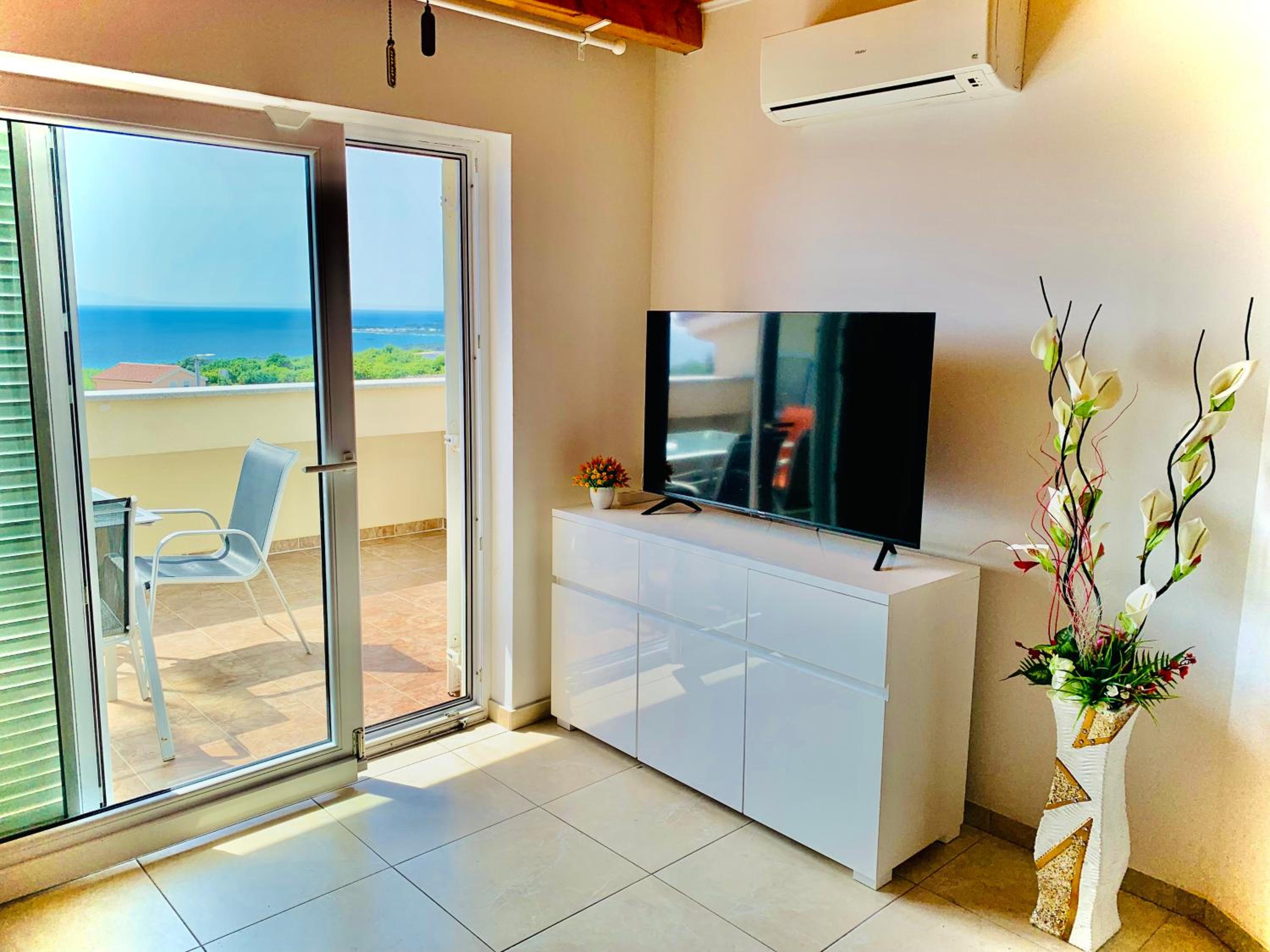 Three-Bedroom Apartment with Terrace and Sea View