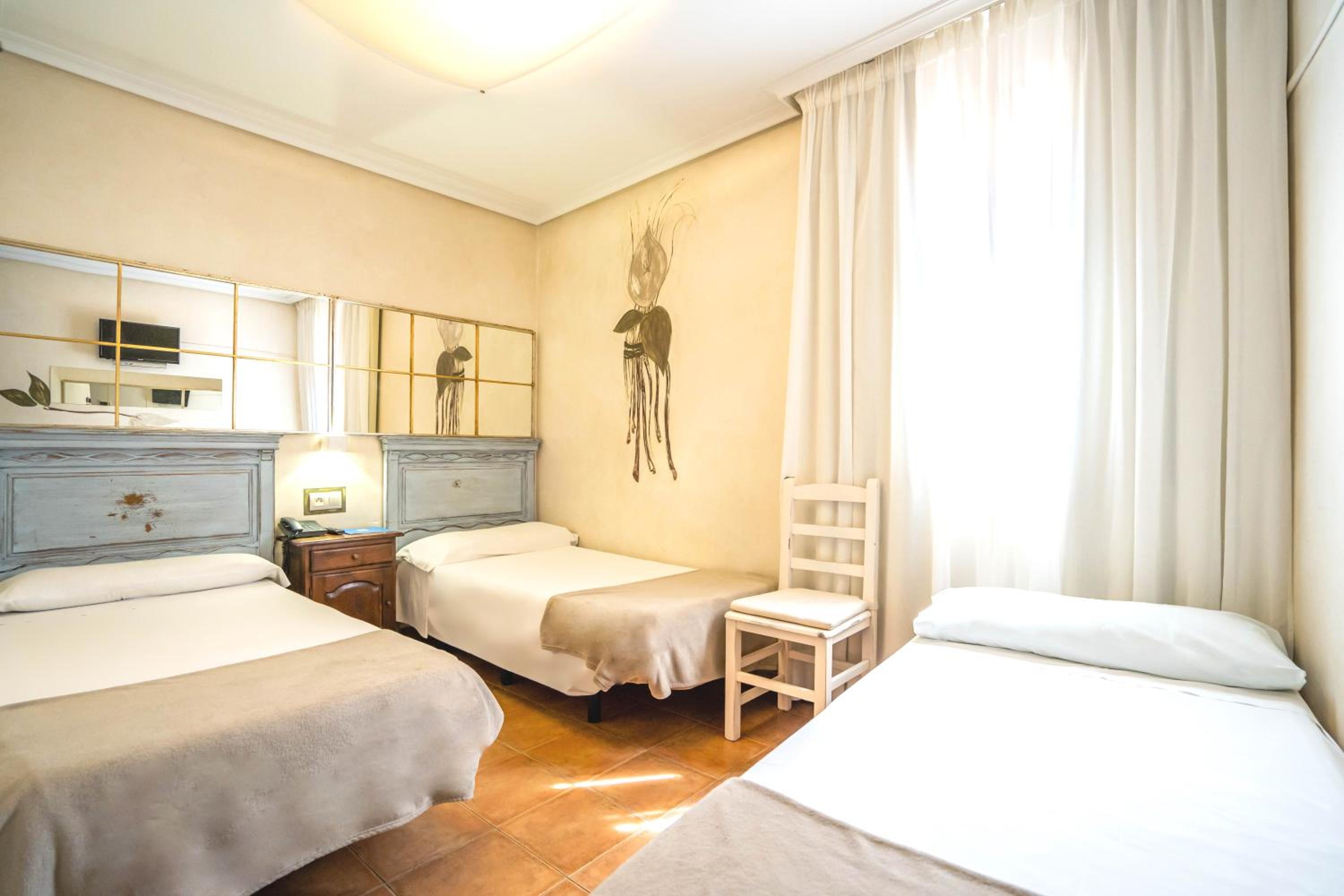 Doble con cama extra