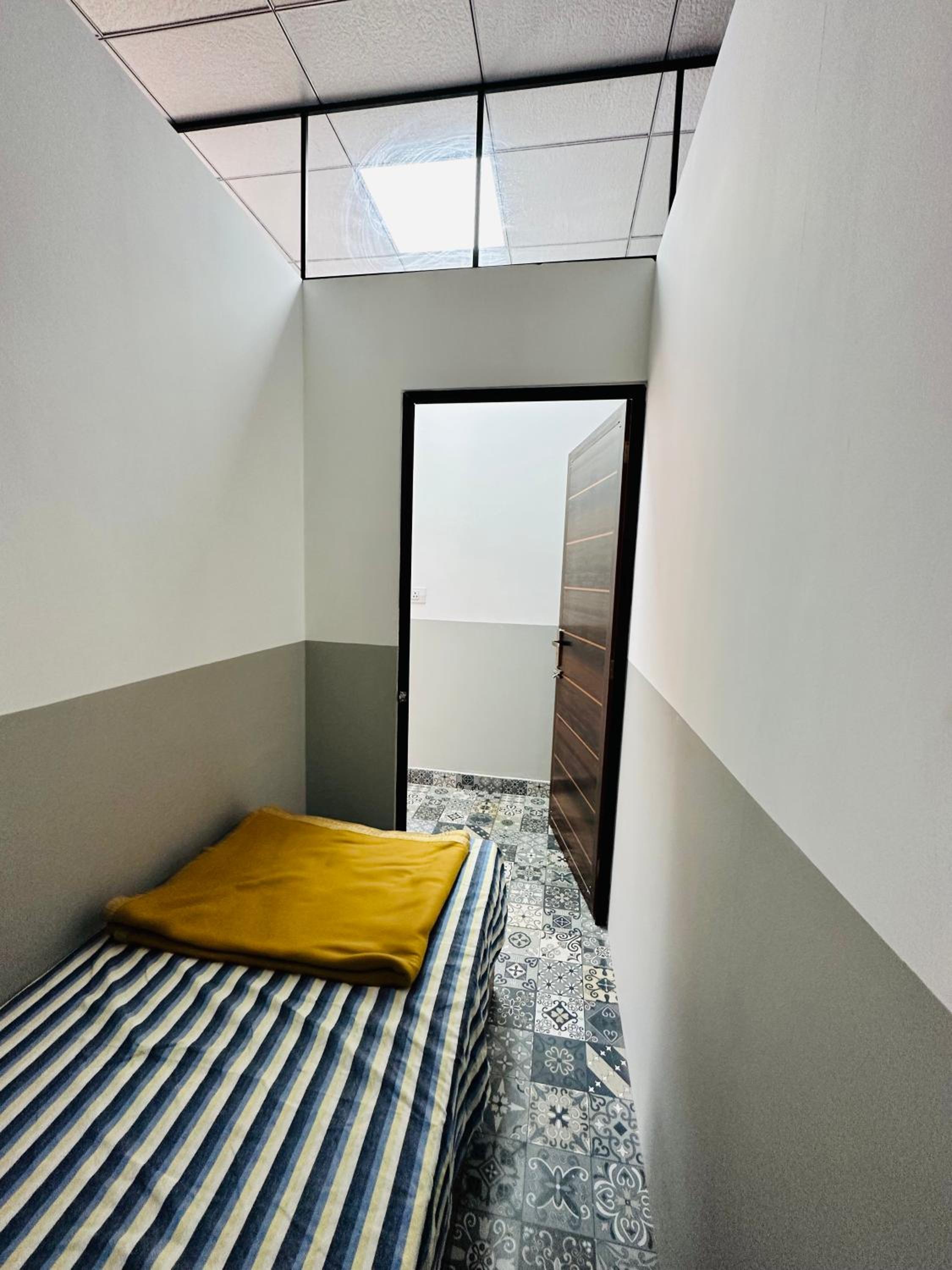 Single Bed In Dormitory Room