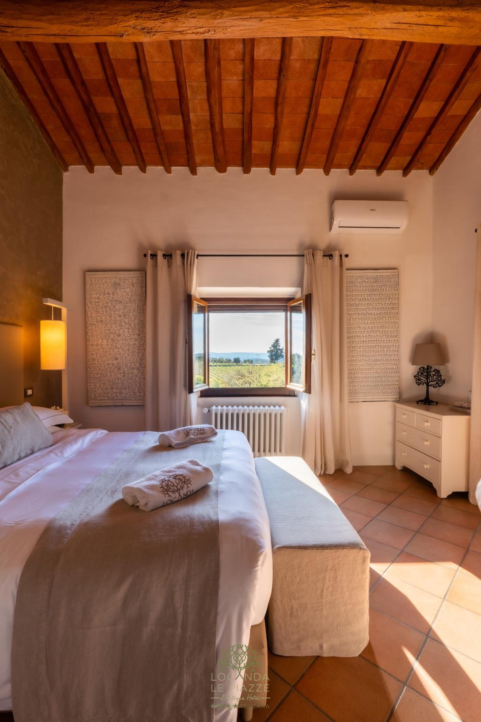 bedroom with a large bed and a view of the ocean