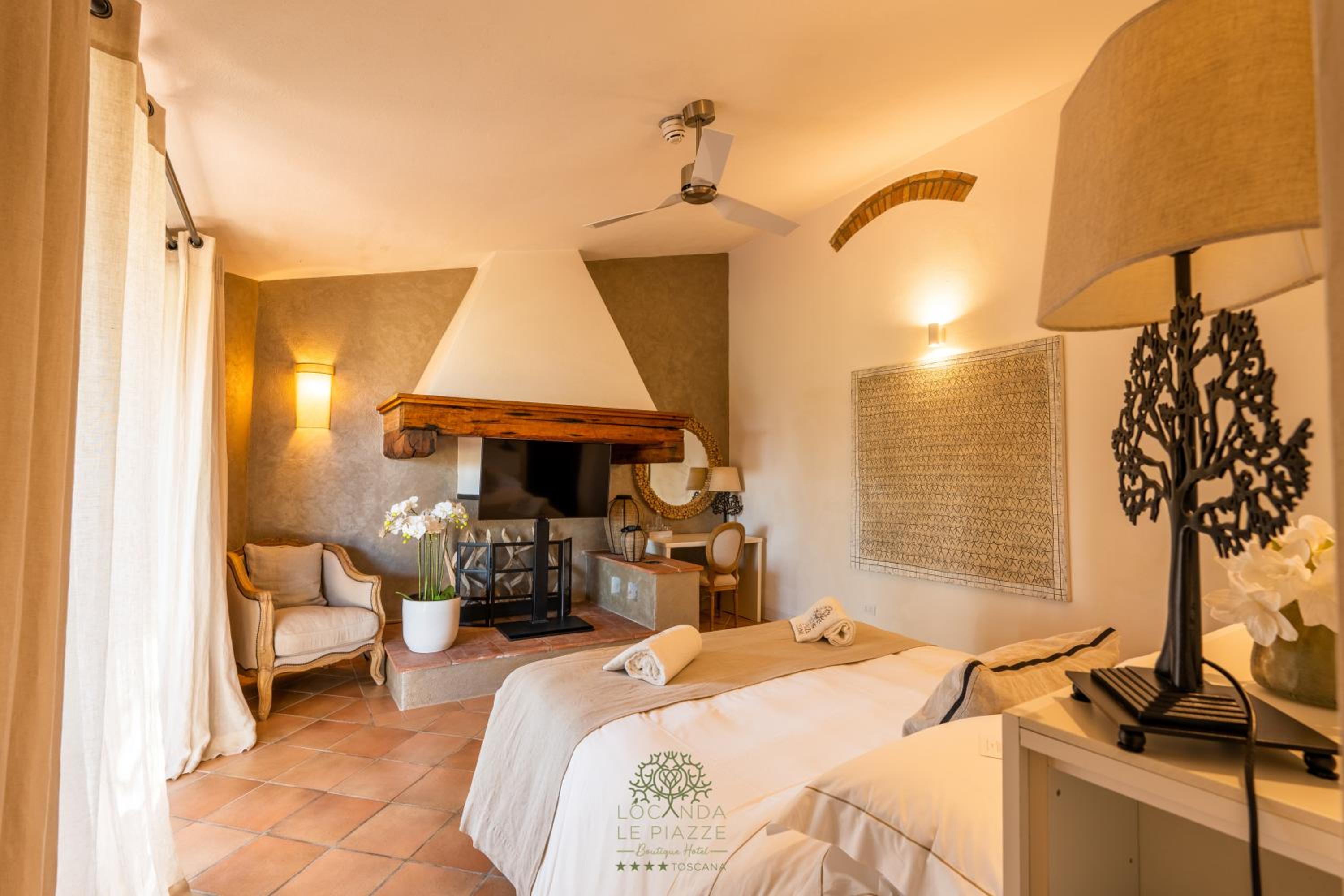 bedroom with a fireplace in the middle of the room