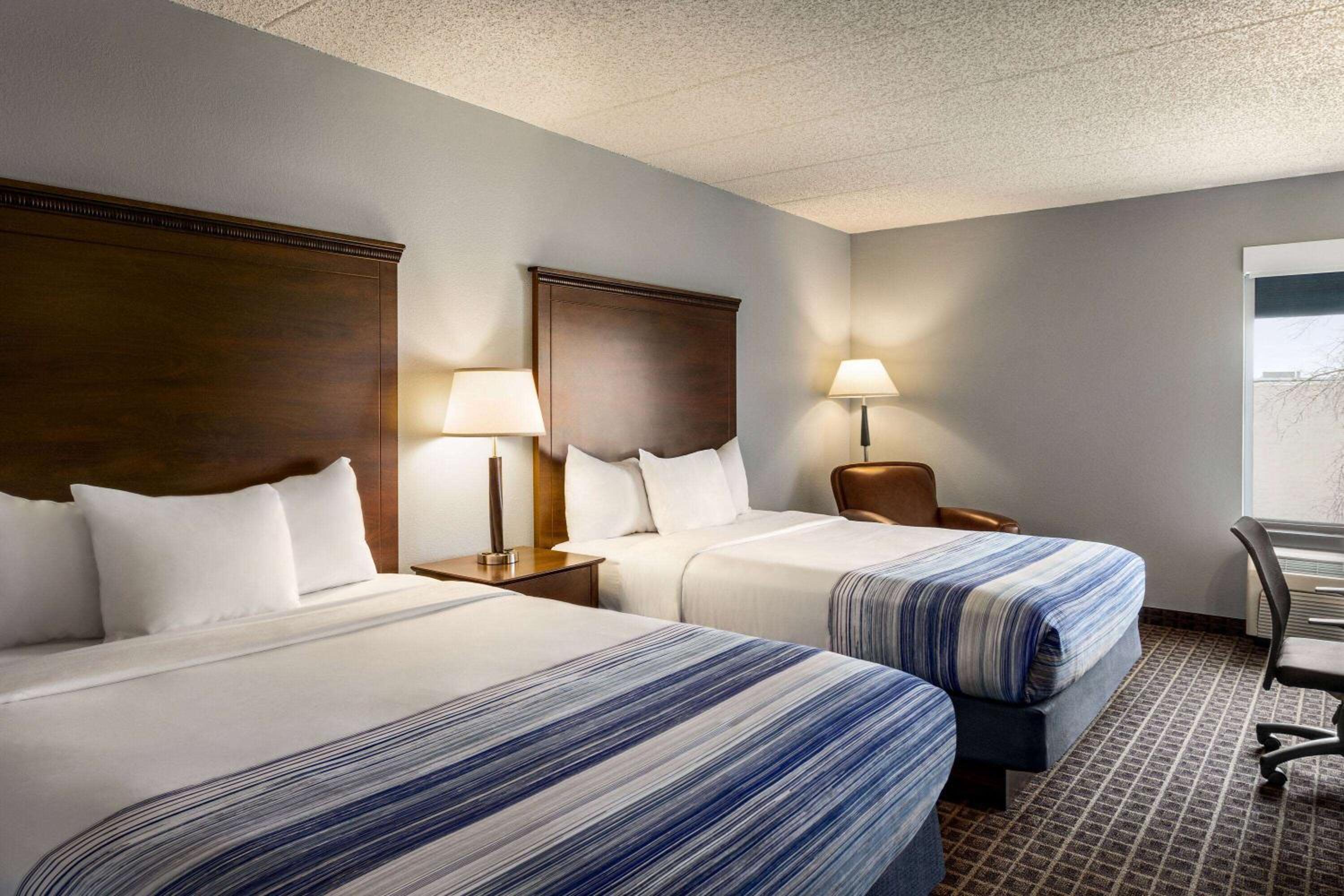Queen Room with Two Queen Beds - Non-Smoking at AmericInn by Wyndham Madison West in Madison