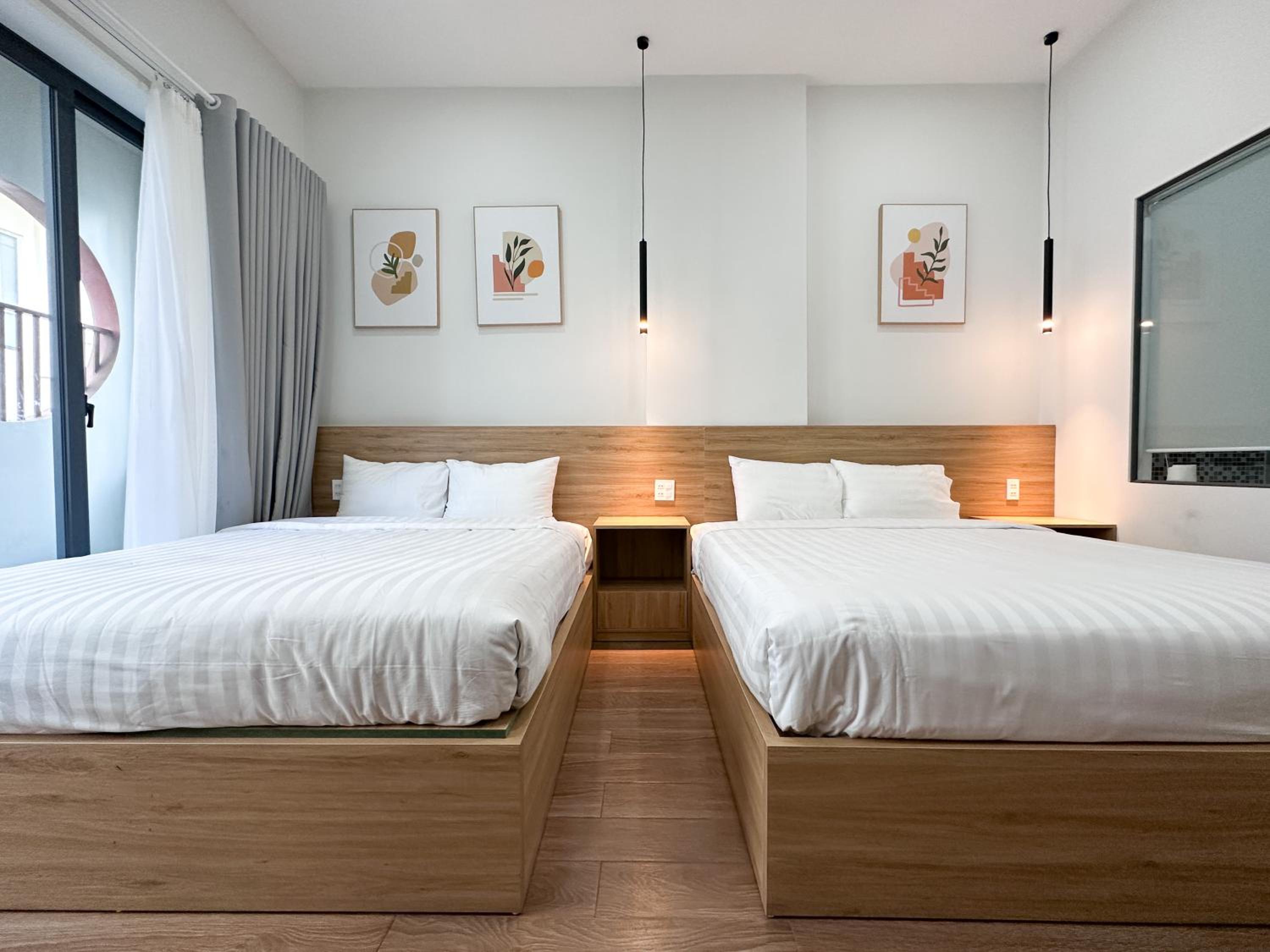 Deluxe Queen Room with Two Queen Beds - Photo 1