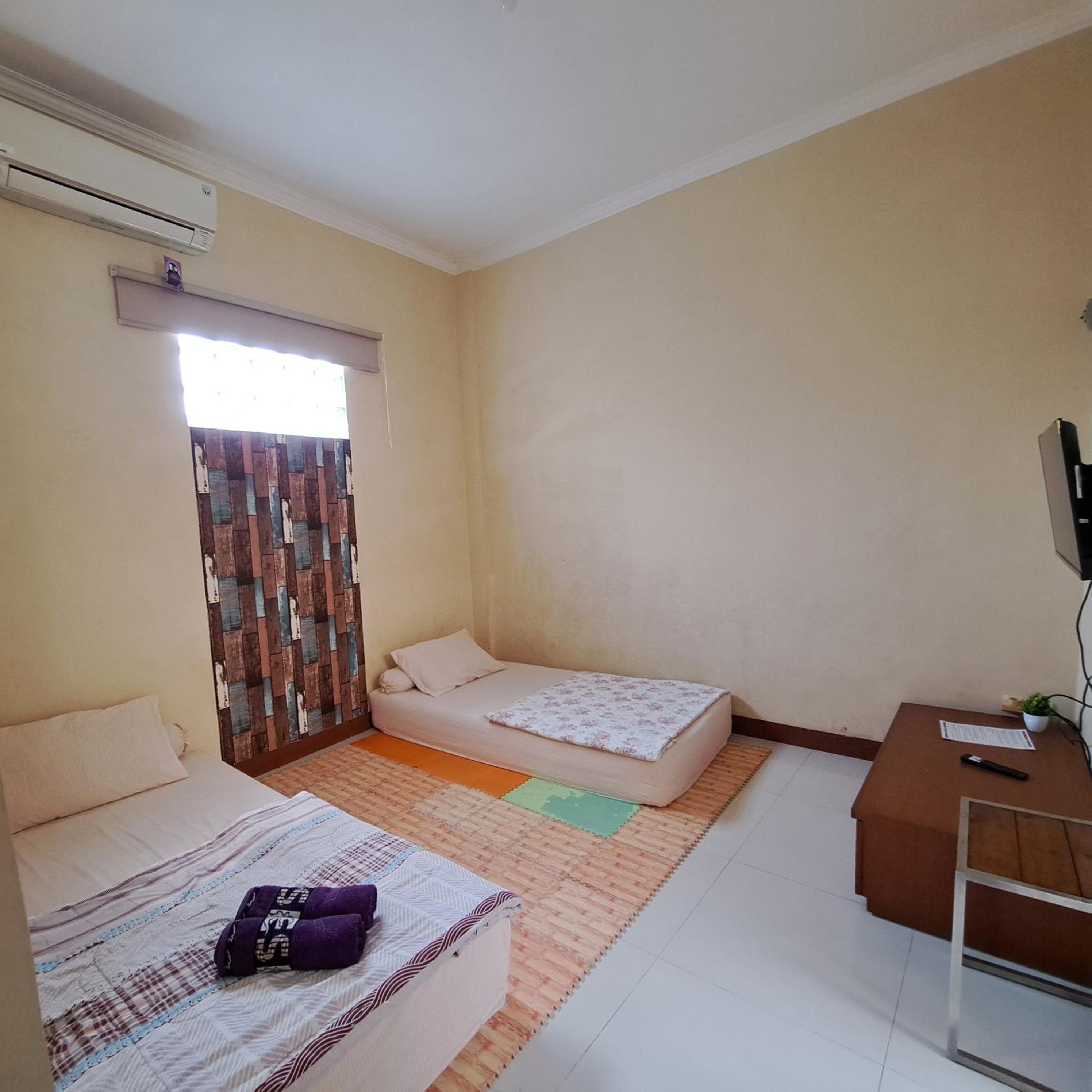 Deluxe Triple Room - Photo 9