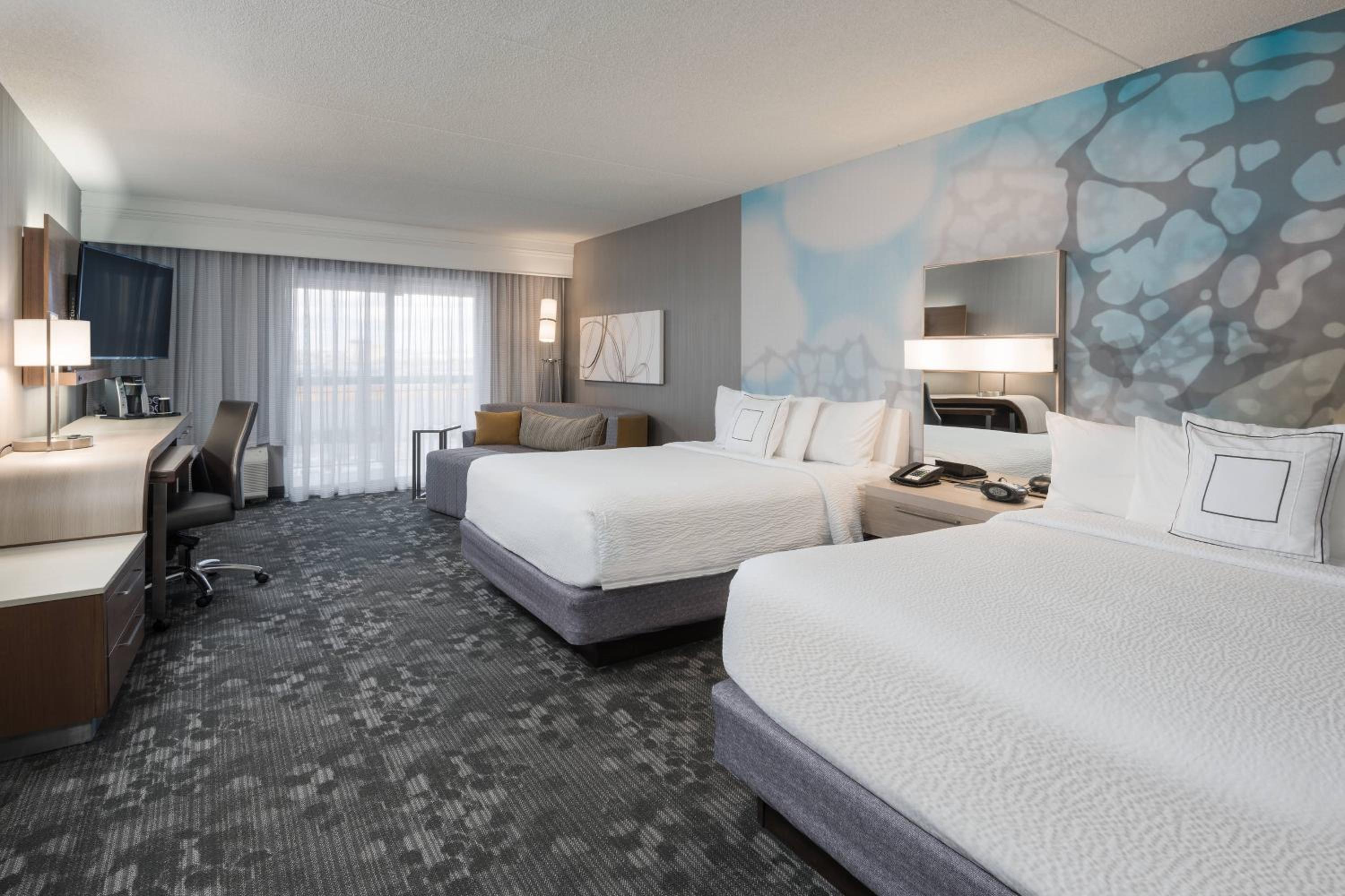 Queen Room with Two Queen Beds and Sofa Bed - Photo 1
