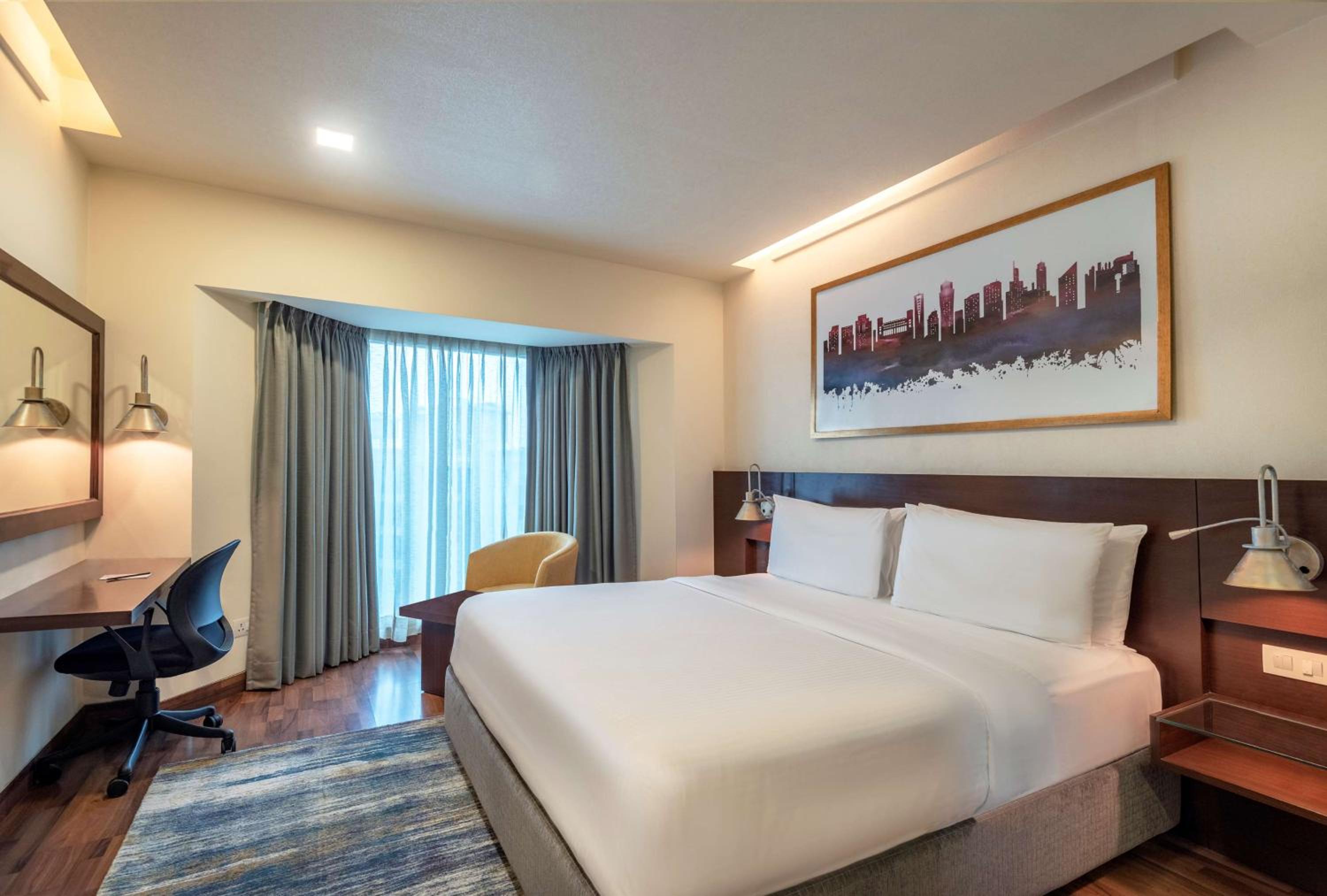 Deluxe Double or Twin Room with 20% Discount on food and soft beverages, Laundry and liquor and spa, INR 500 credit, one mug of freshly brewed beer during the stay ((330 ml)
