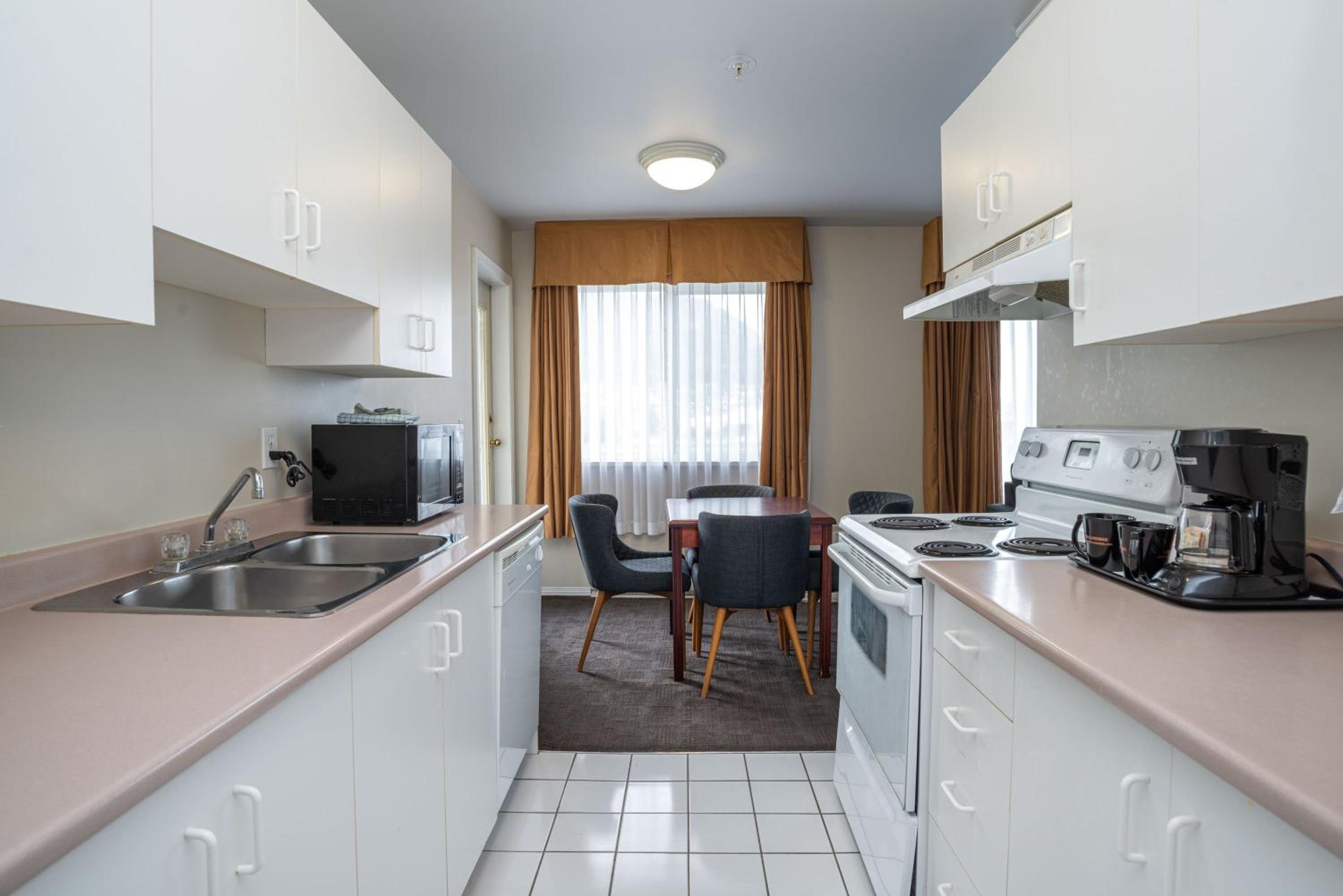 2 Bedroom Suite, 1 King, 1 Queen, Sofa Bed, Kitchen - Photo 4