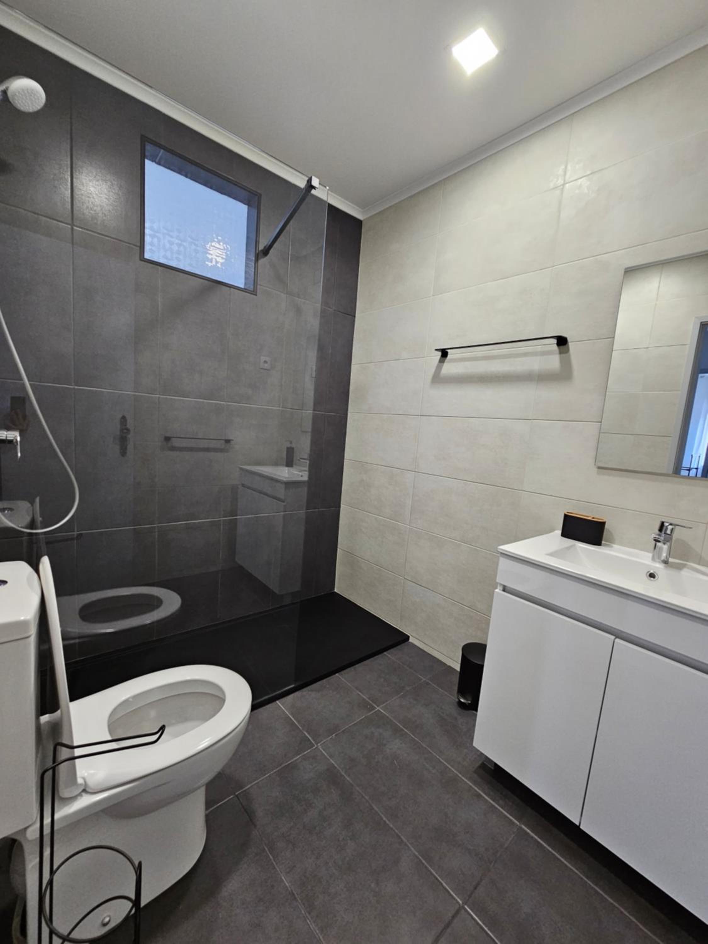 Three-Bedroom Apartment with Balcony - Photo 13