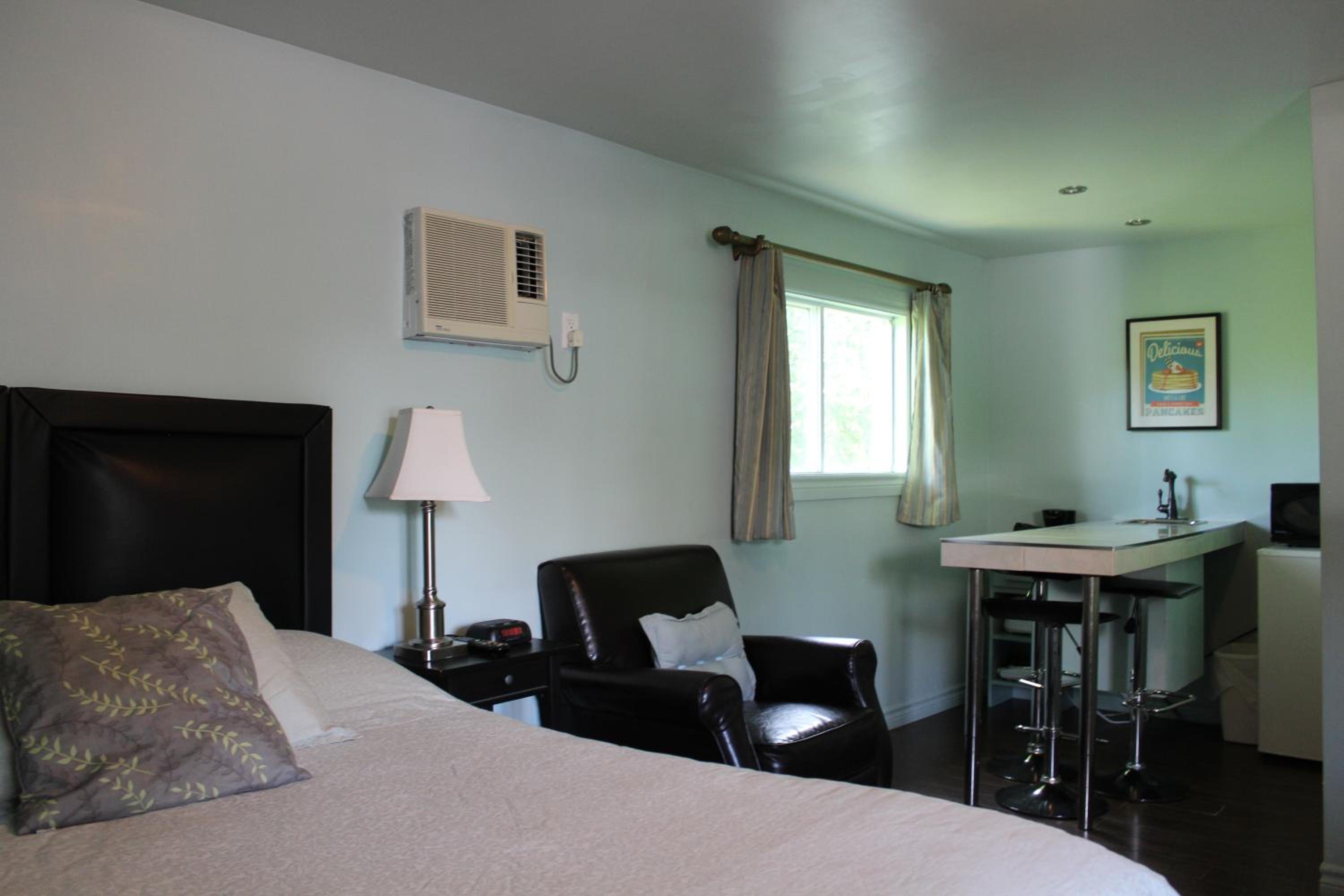 Deluxe Queen Room with Two Queen Beds - Photo 1