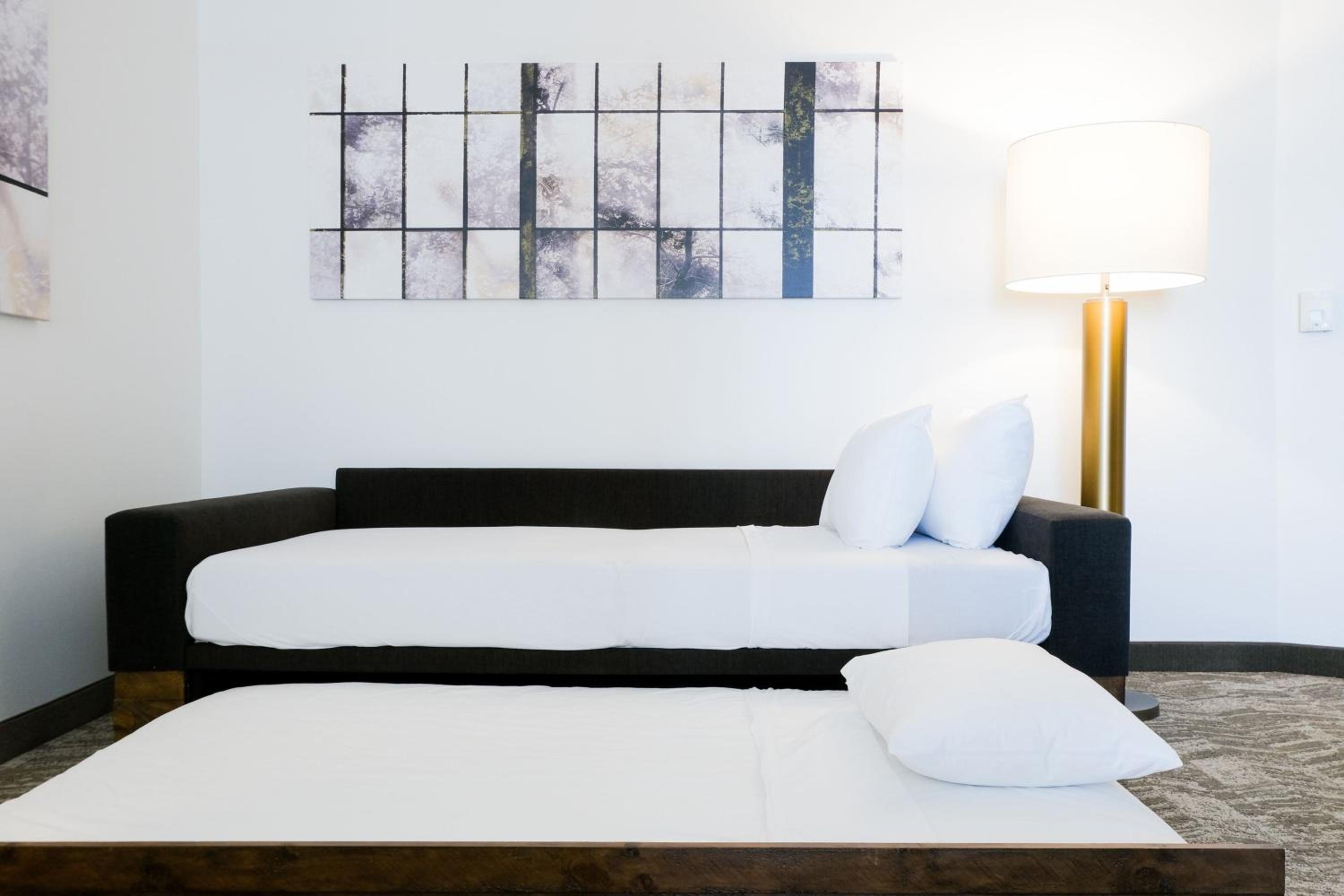Two-Bedroom Suite with One King Bed, Two Queen Beds and Trundle Sofa