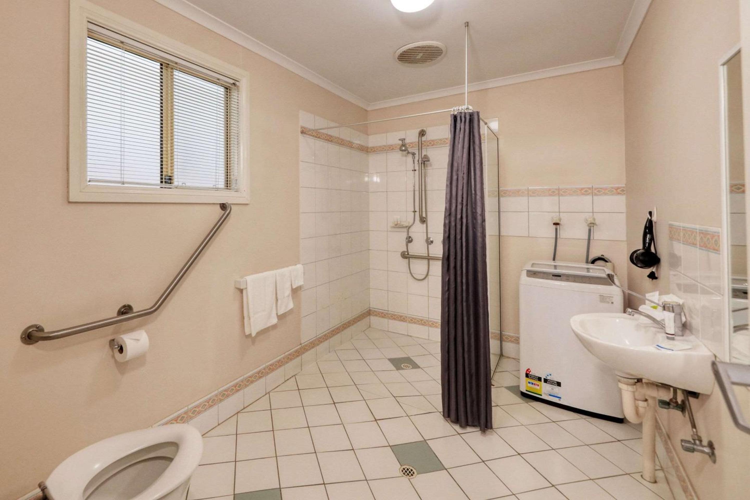 Suite with One Queen Bed, Three Single Beds