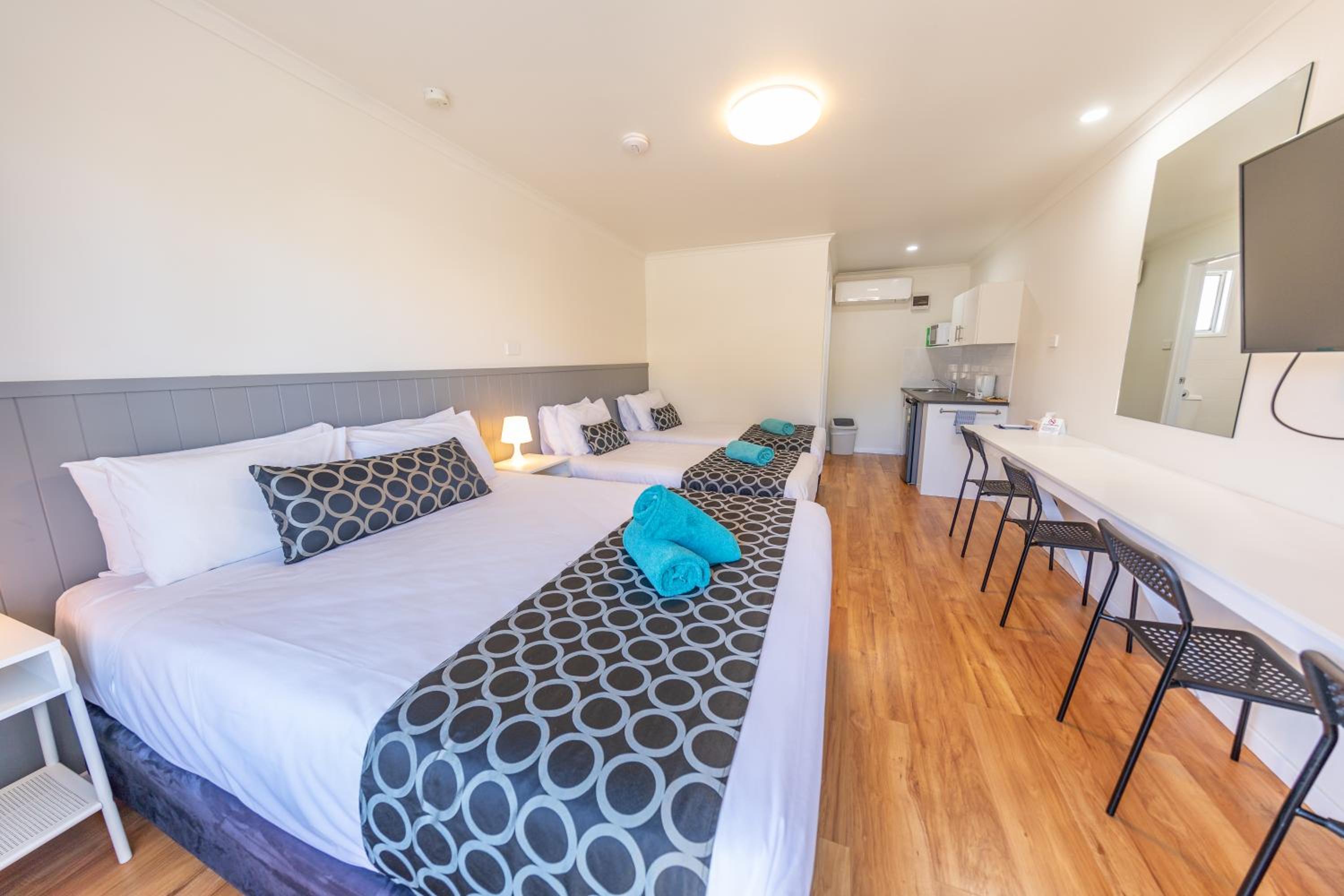 Deluxe Room with Queen and Two Single Beds