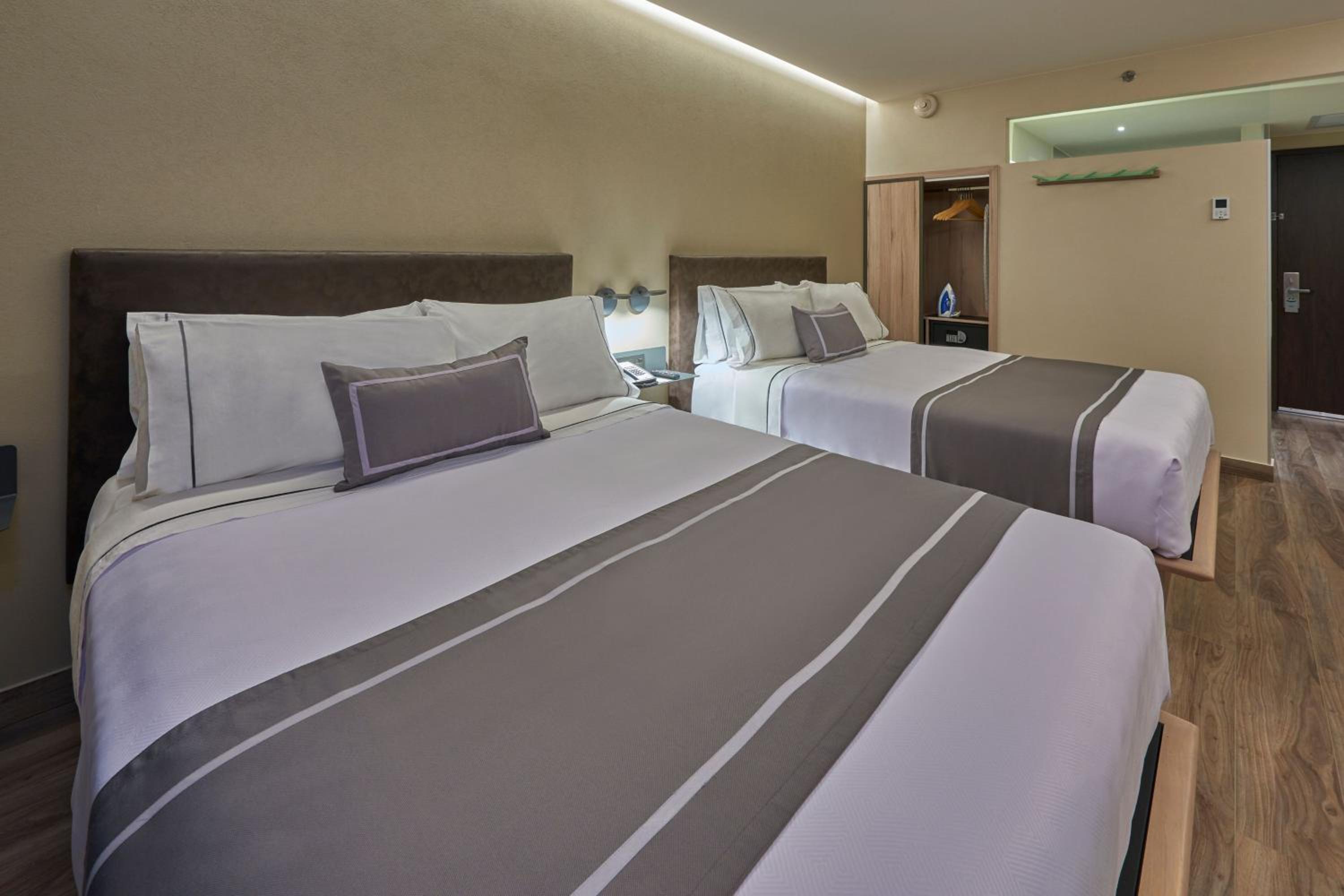 Queen Room with Two Queen Beds - Photo 1