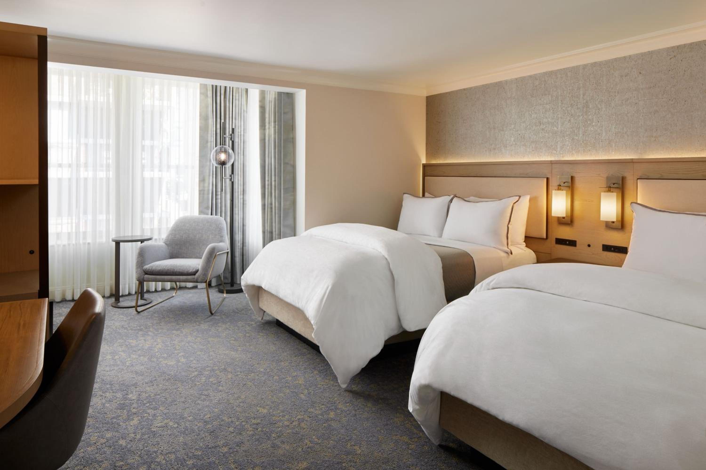 Premium Studio Suite with Two Queen Beds with Sofa Bed and Courtyard View - Photo 1