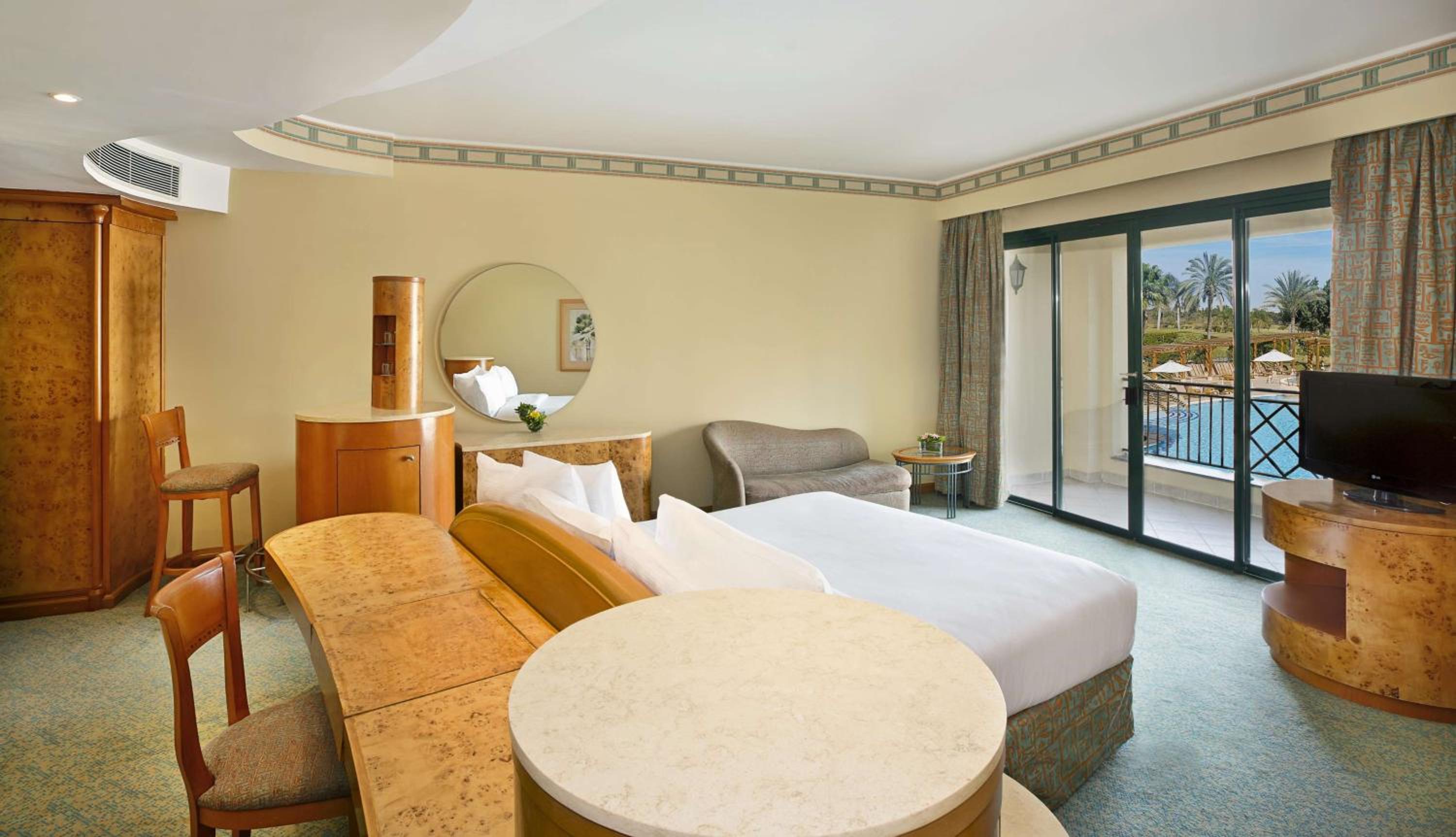 Deluxe King Room with Pool View - Photo 1