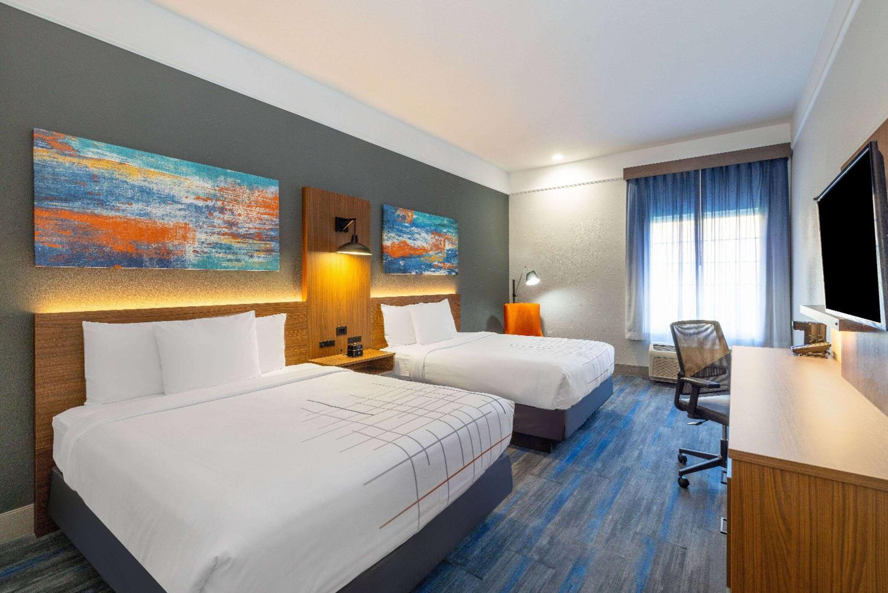 Deluxe Queen Room with Two Queen Beds - Photo 1