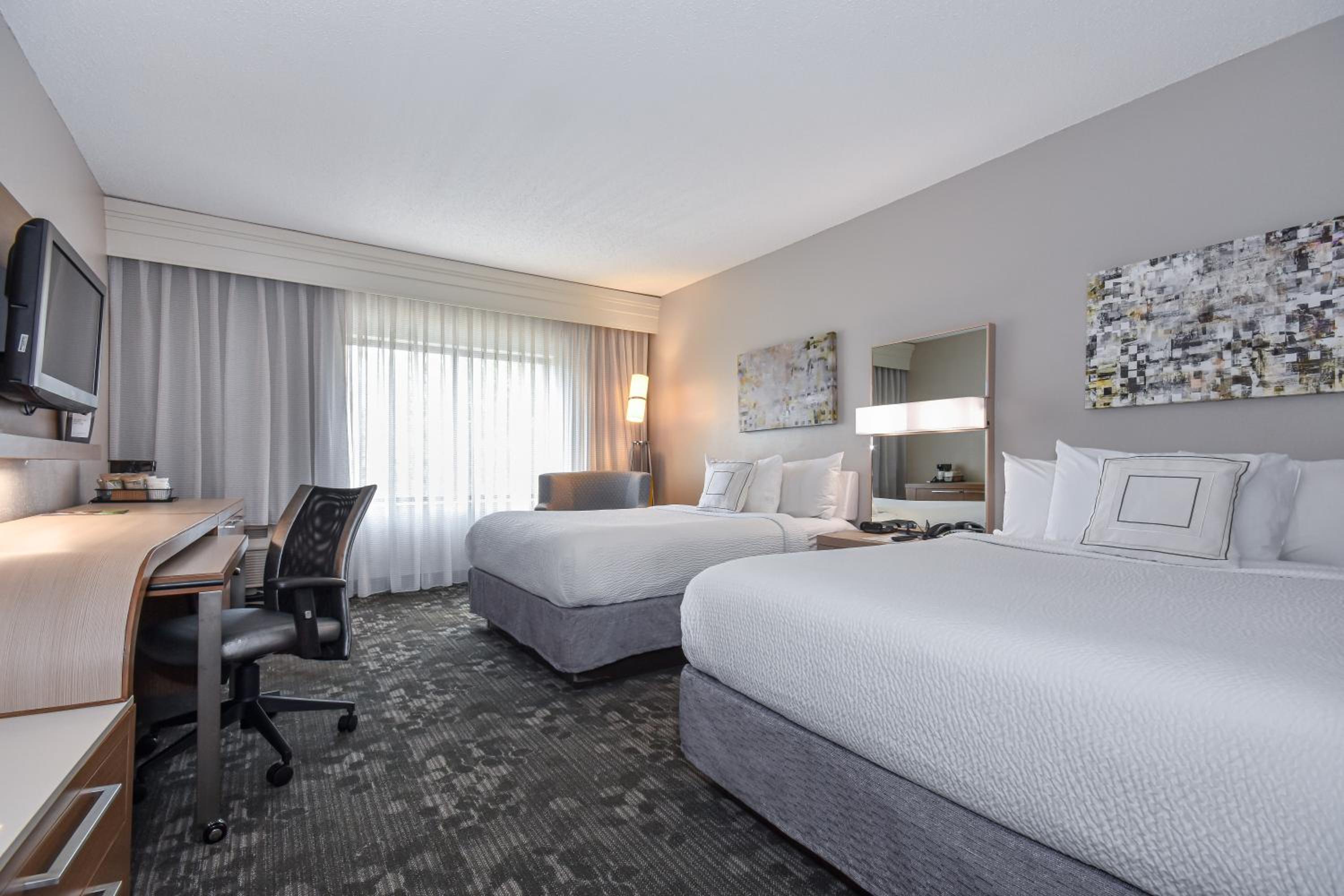 Queen Room with Two Queen Beds - Photo 1