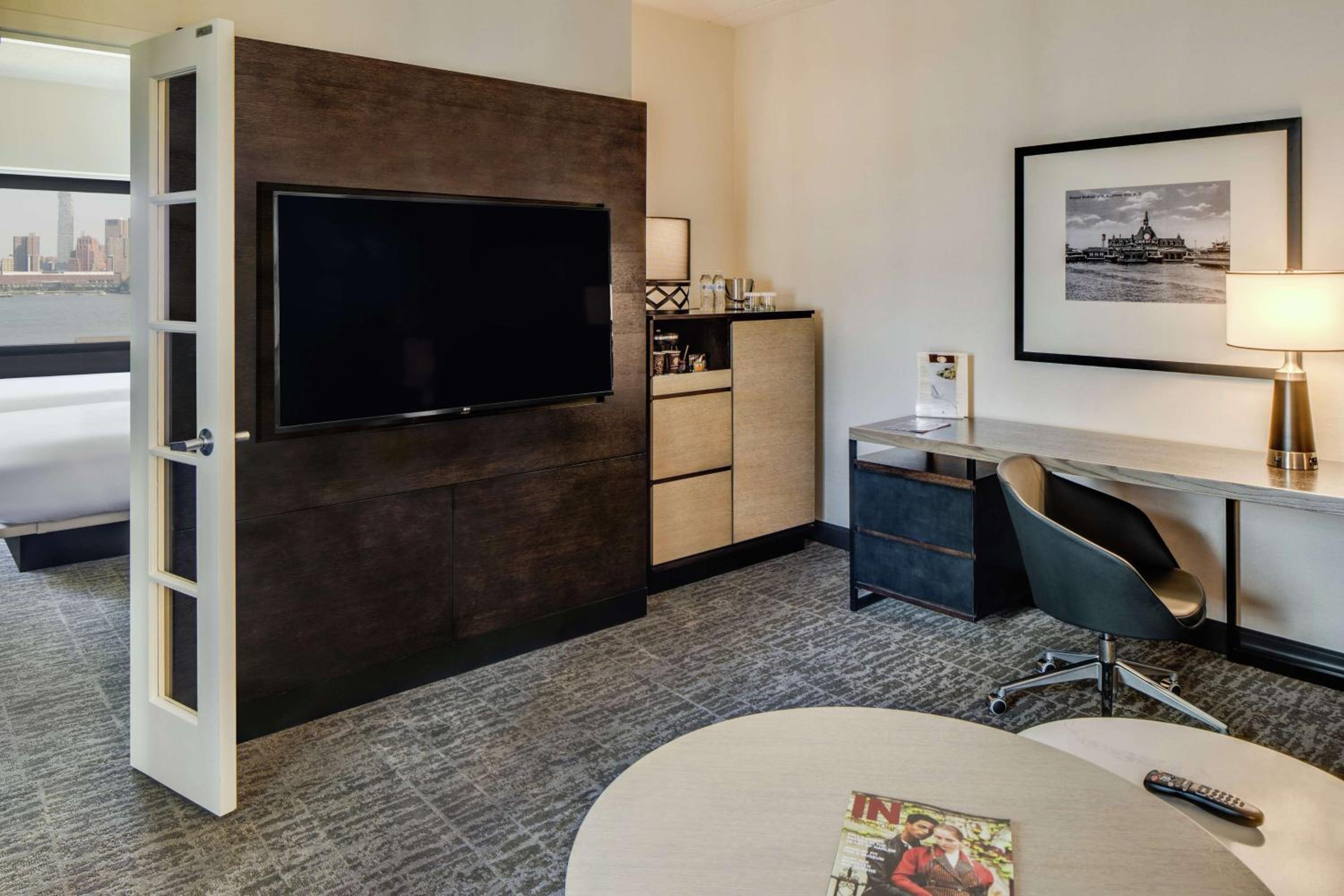 One-Bedroom Corner King Suite with Sofa Bed - Photo 1