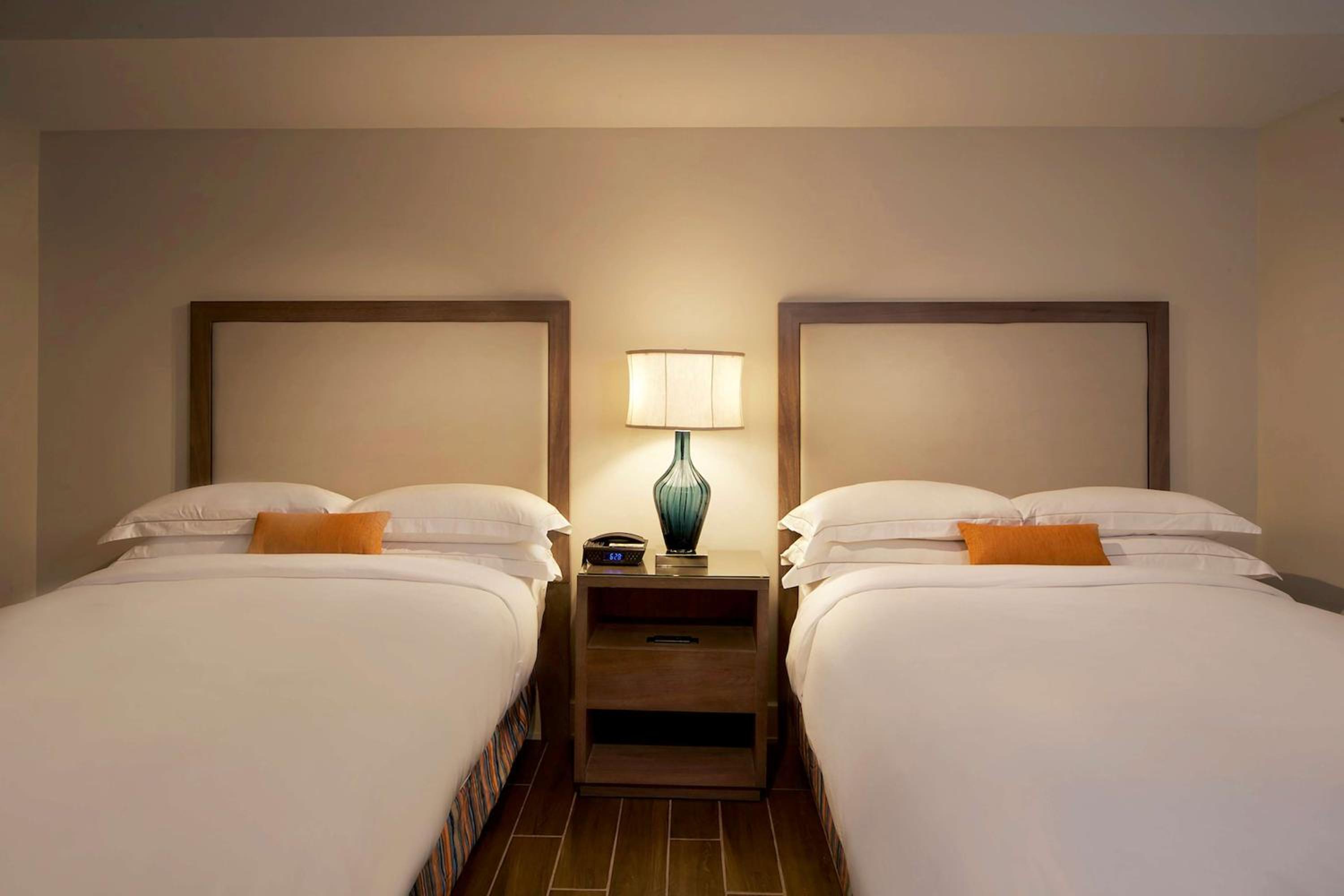 Two-Bedroom Suite with One King Bed, Two Double Beds and Roll-in Shower - Accessible