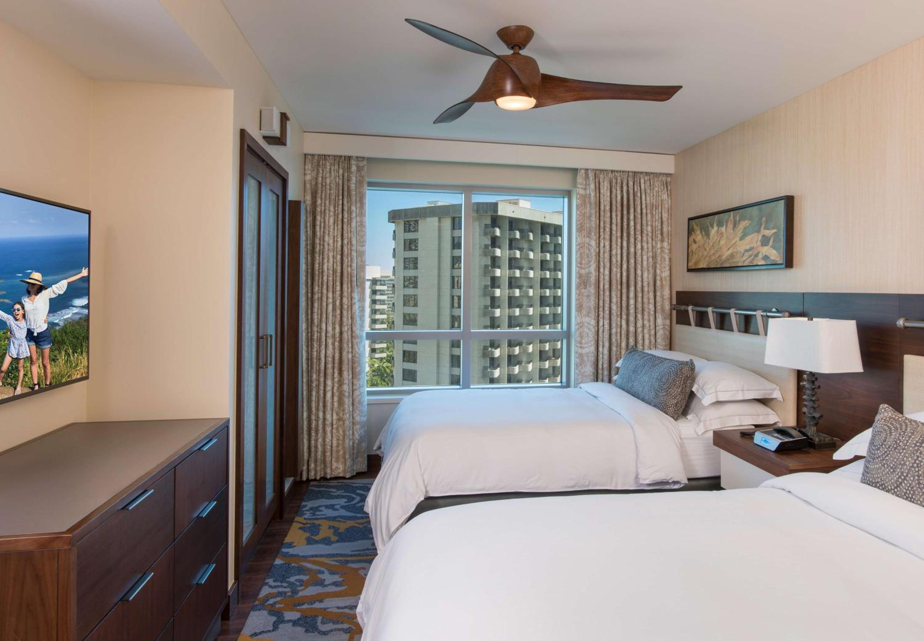 One-Bedroom Suite with Two Double Beds and Partial Ocean View