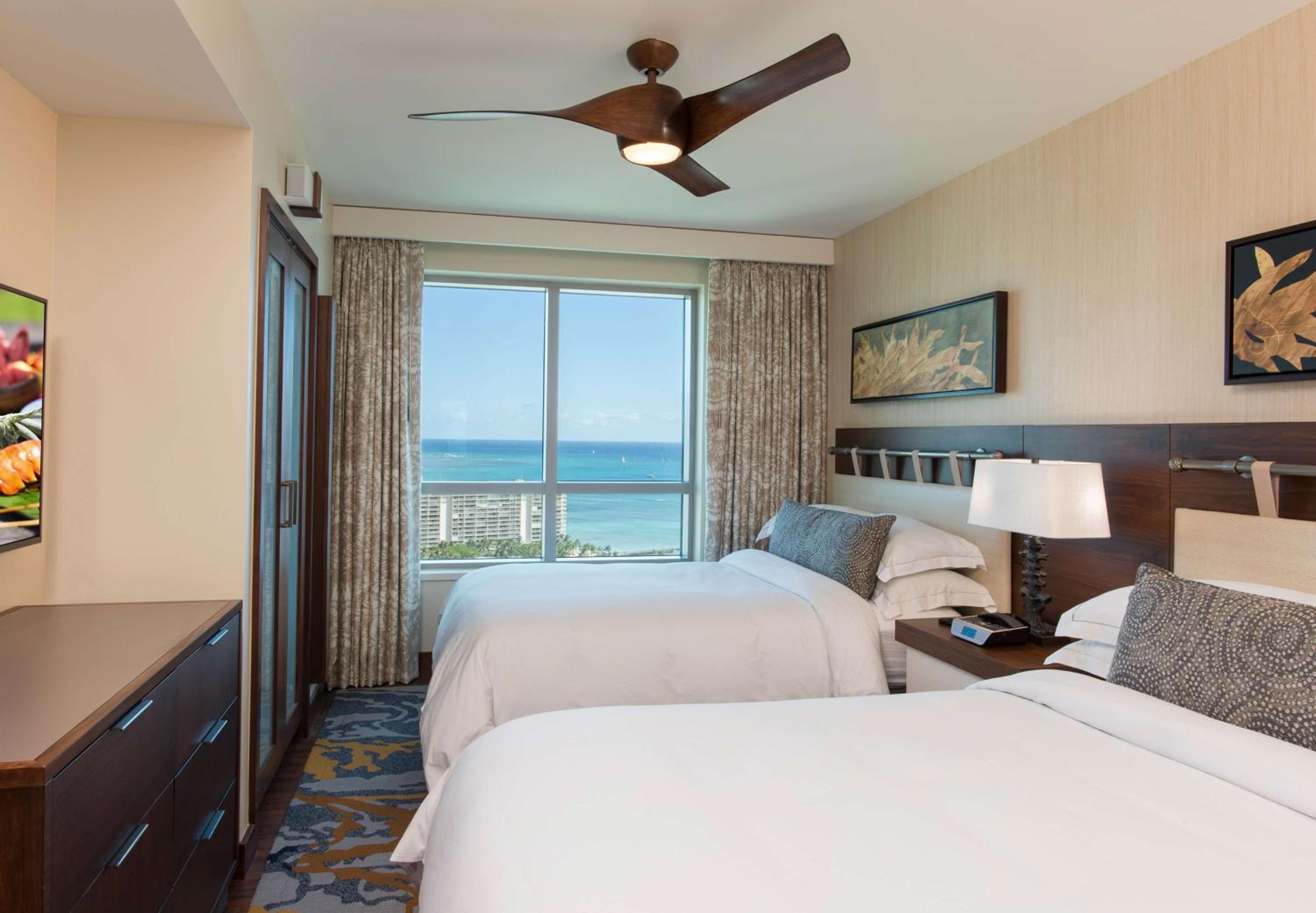 One-Bedroom Luxury Suite with Two Double Beds and Ocean View