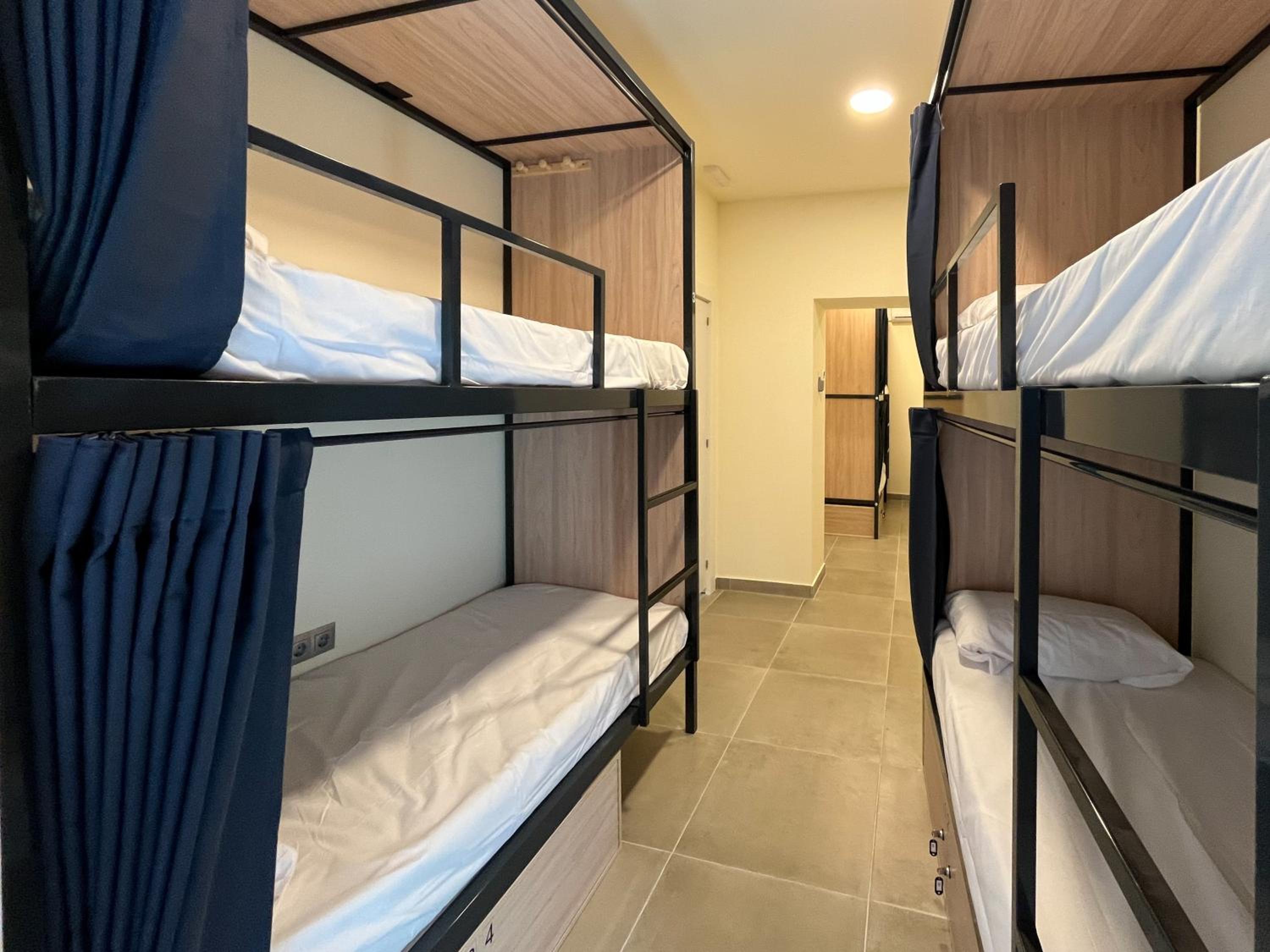 Cama en habitación compartida de 6 camas