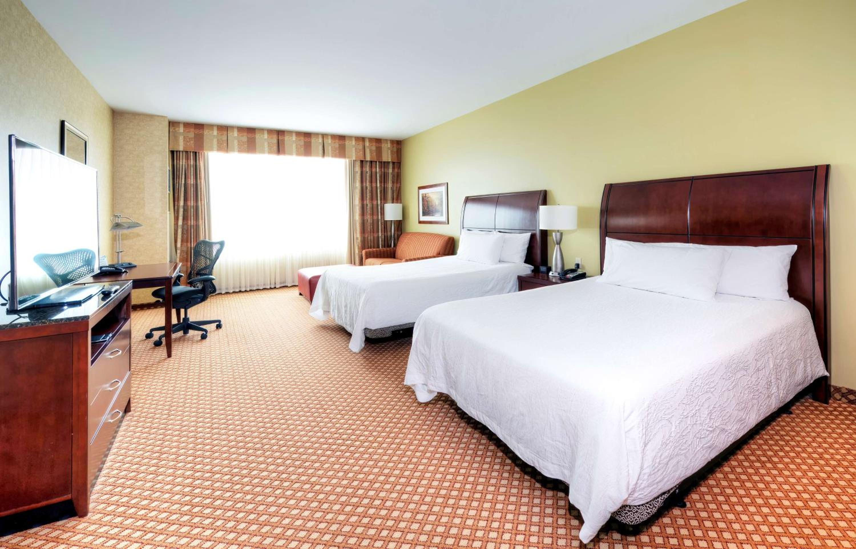 Deluxe Queen Room with Two Queen Beds and Bathtub - Photo 1