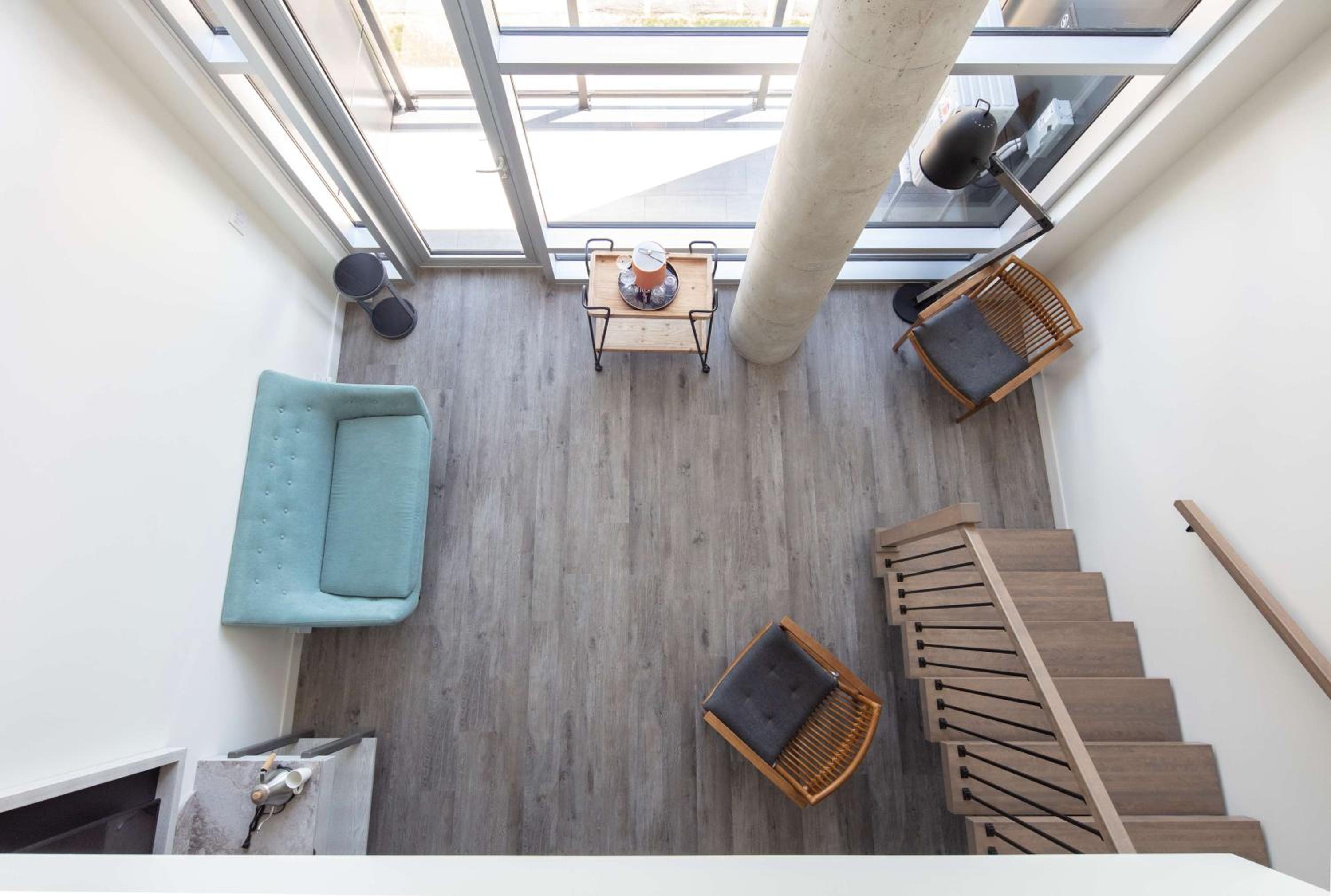 Two-Level King Suite with Balcony and Kitchen - Photo 1
