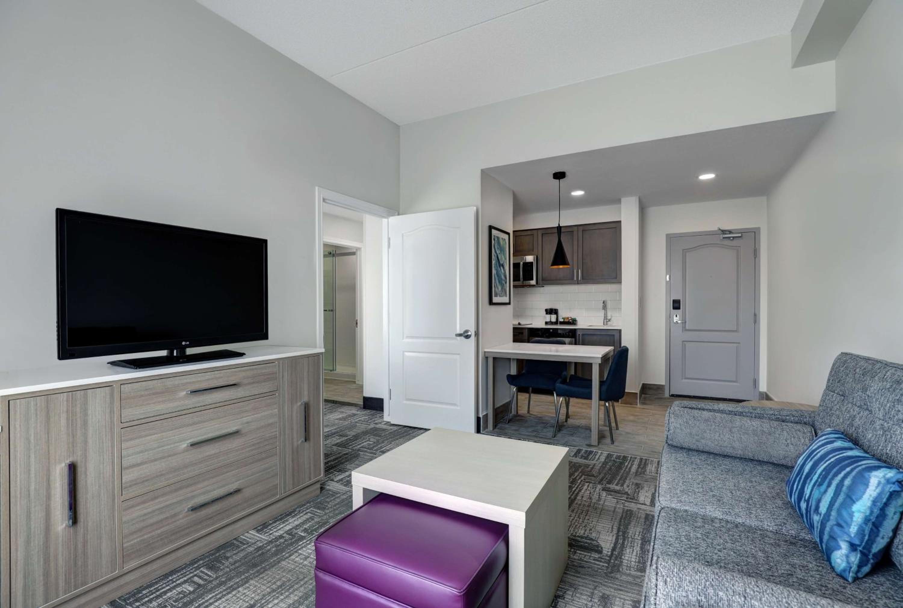 living room with a couch and a flat screen tv