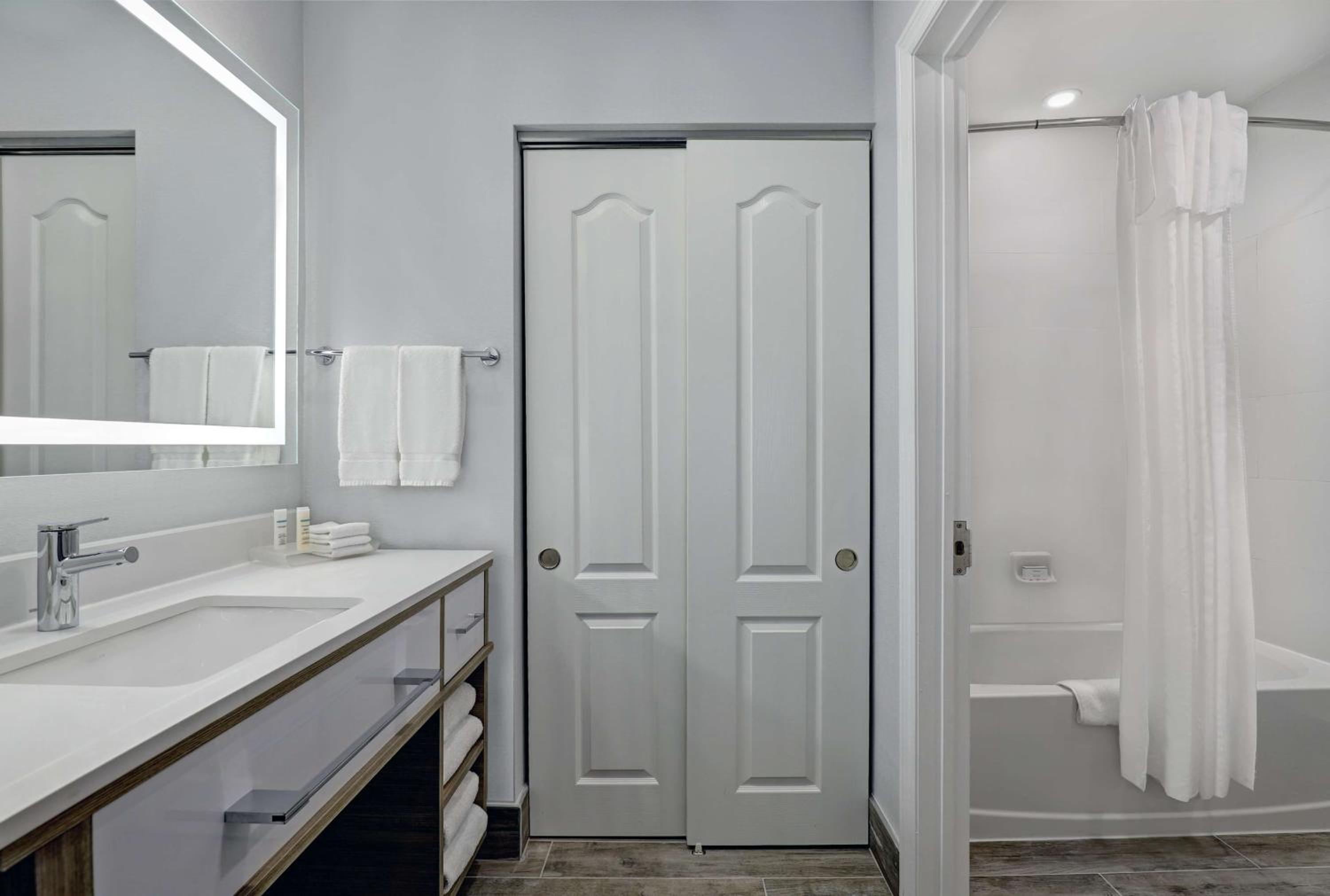 bathroom with a shower, sink, and bathtub