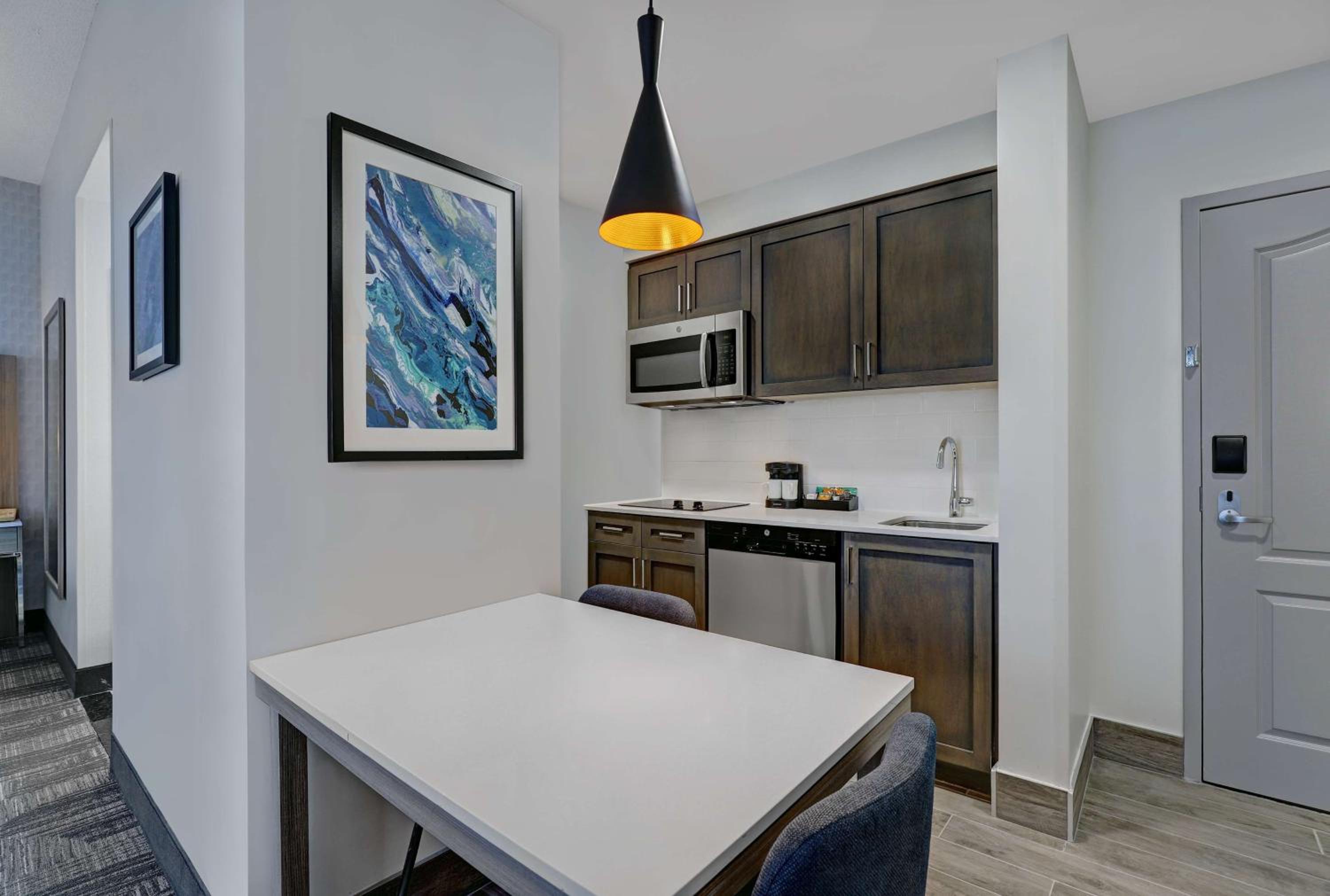 kitchen with a table and chairs in front of it