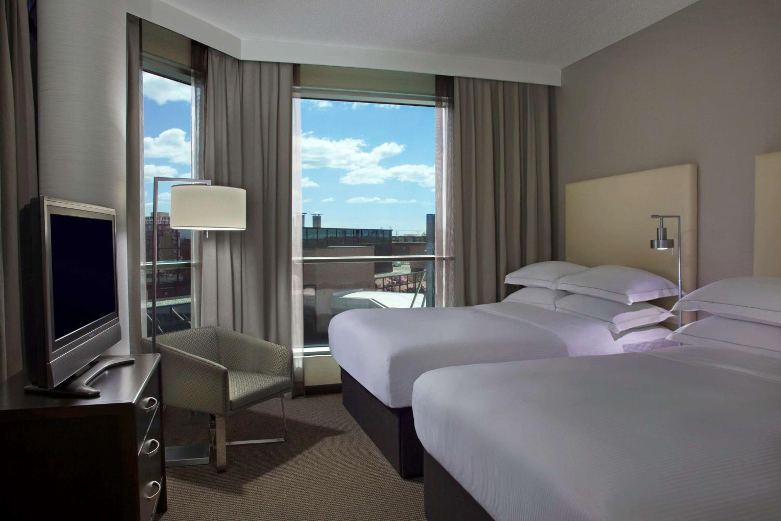 One-Bedroom Corner Suite with Two Double Beds