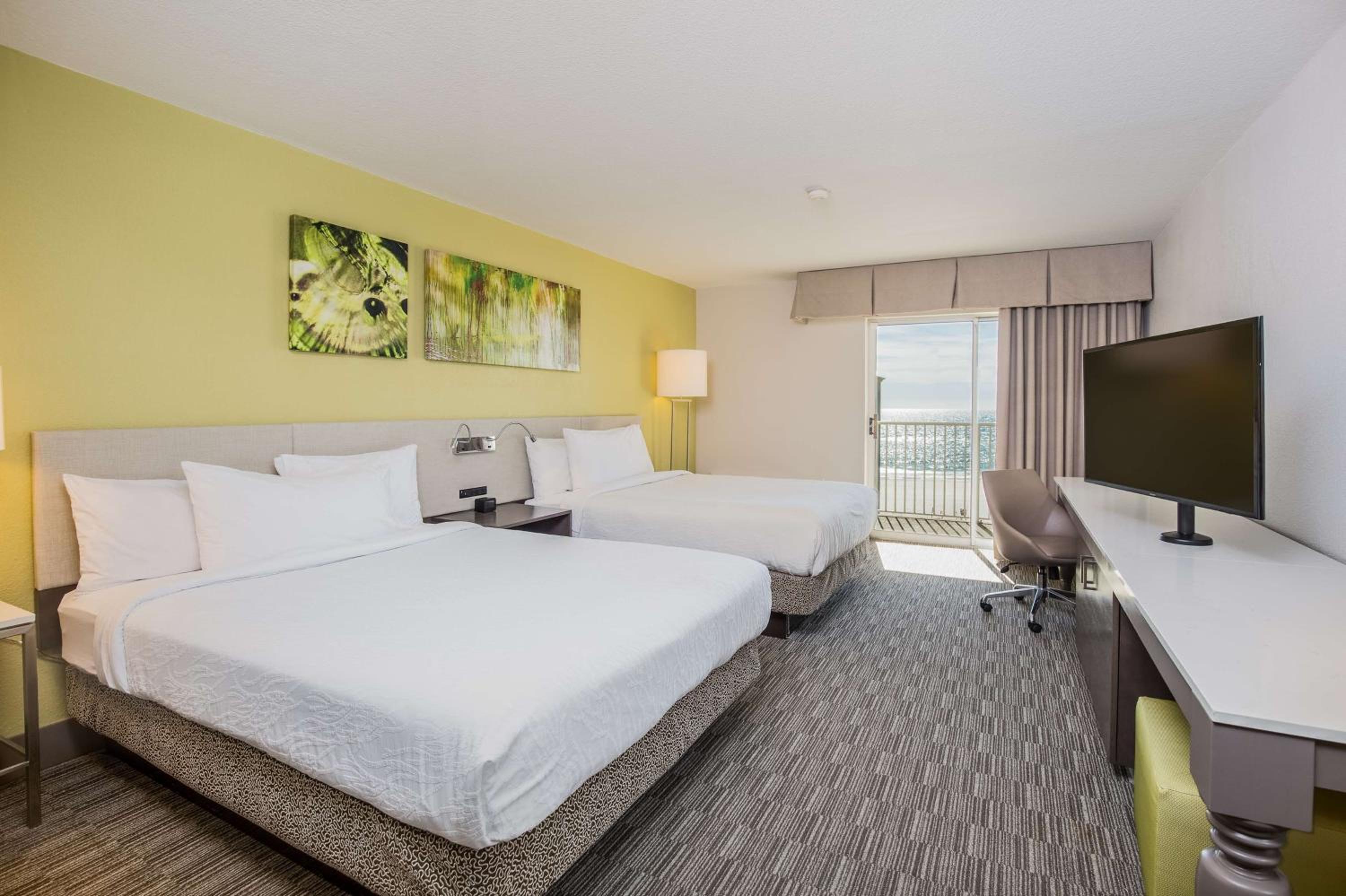 Queen Room with Two Queen Beds and Balcony - Pool/Sea View- Non-Smoking