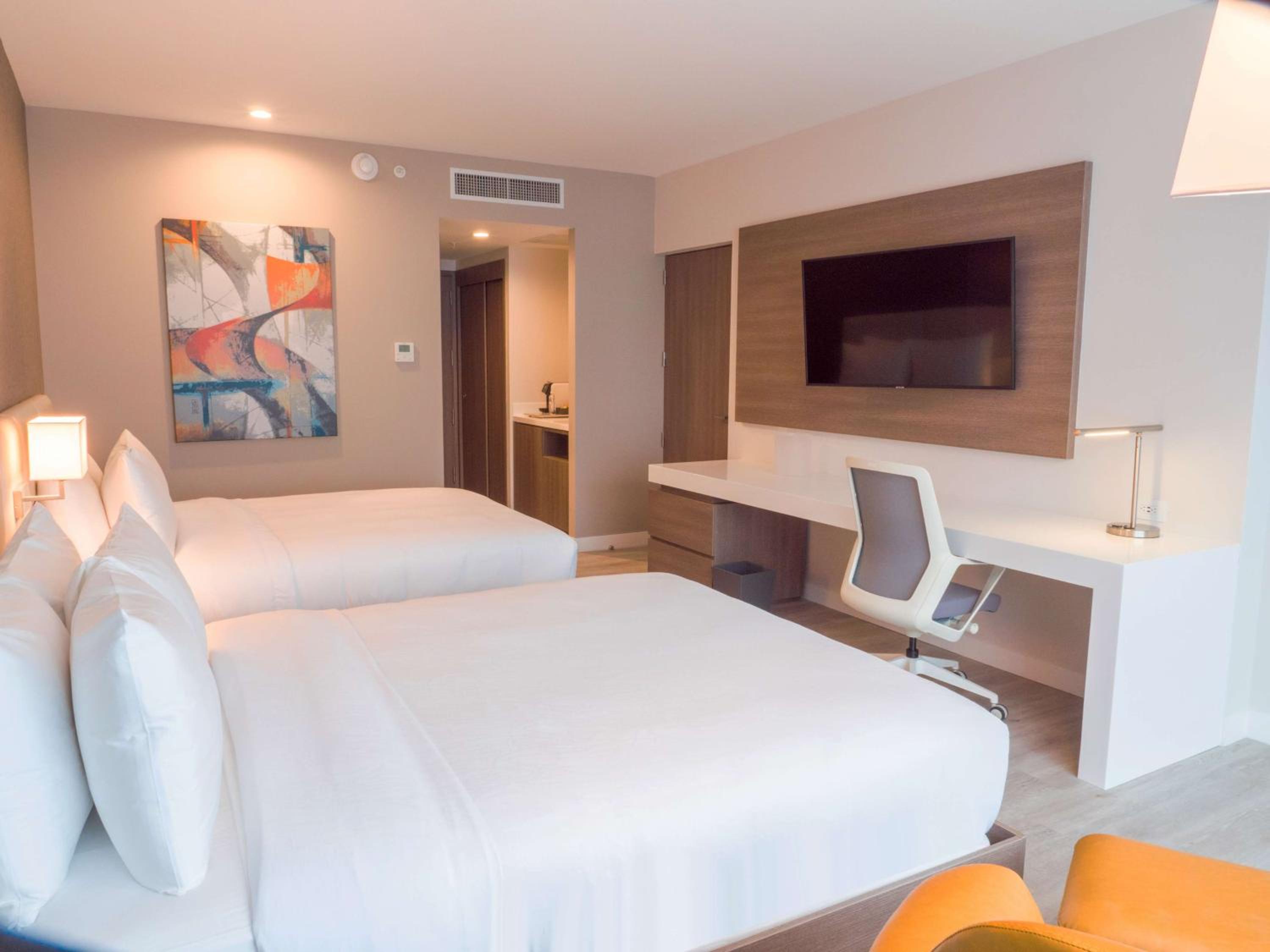 Queen Room with Two Queen Beds - Photo 1