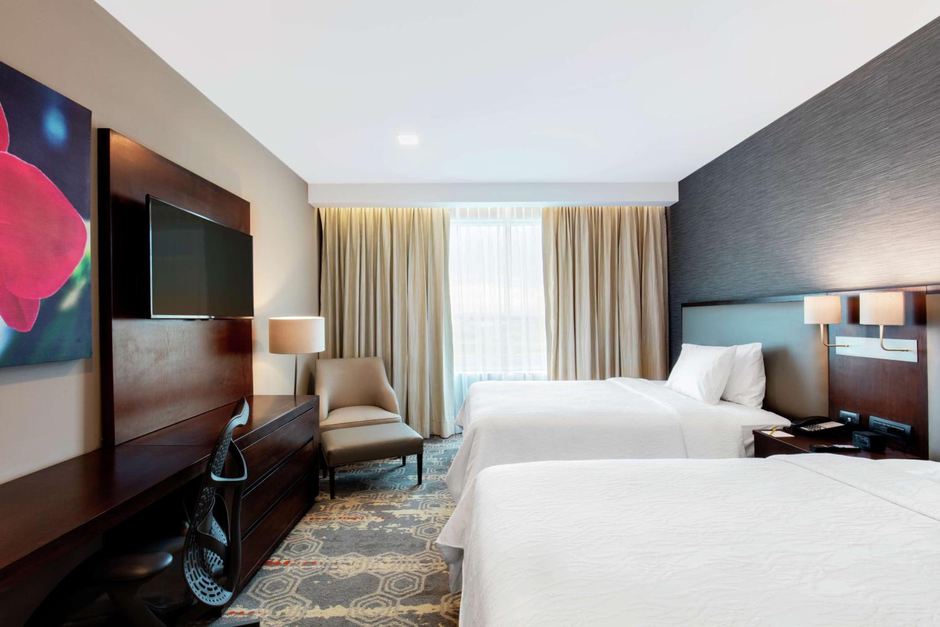 Deluxe Queen Room with Two Queen Beds and Balcony photo 1
