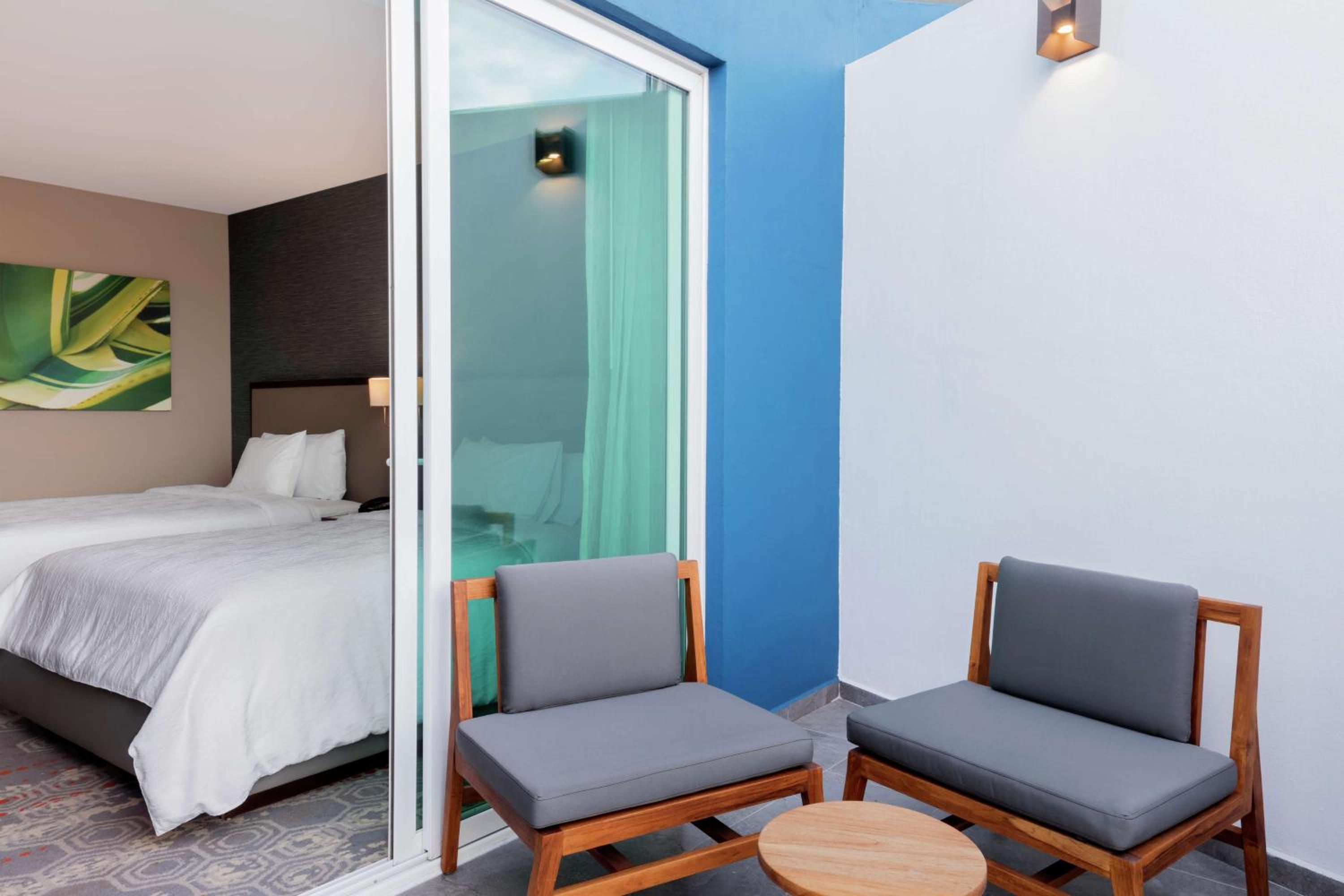 Deluxe Queen Room with Two Queen Beds and Balcony photo 2