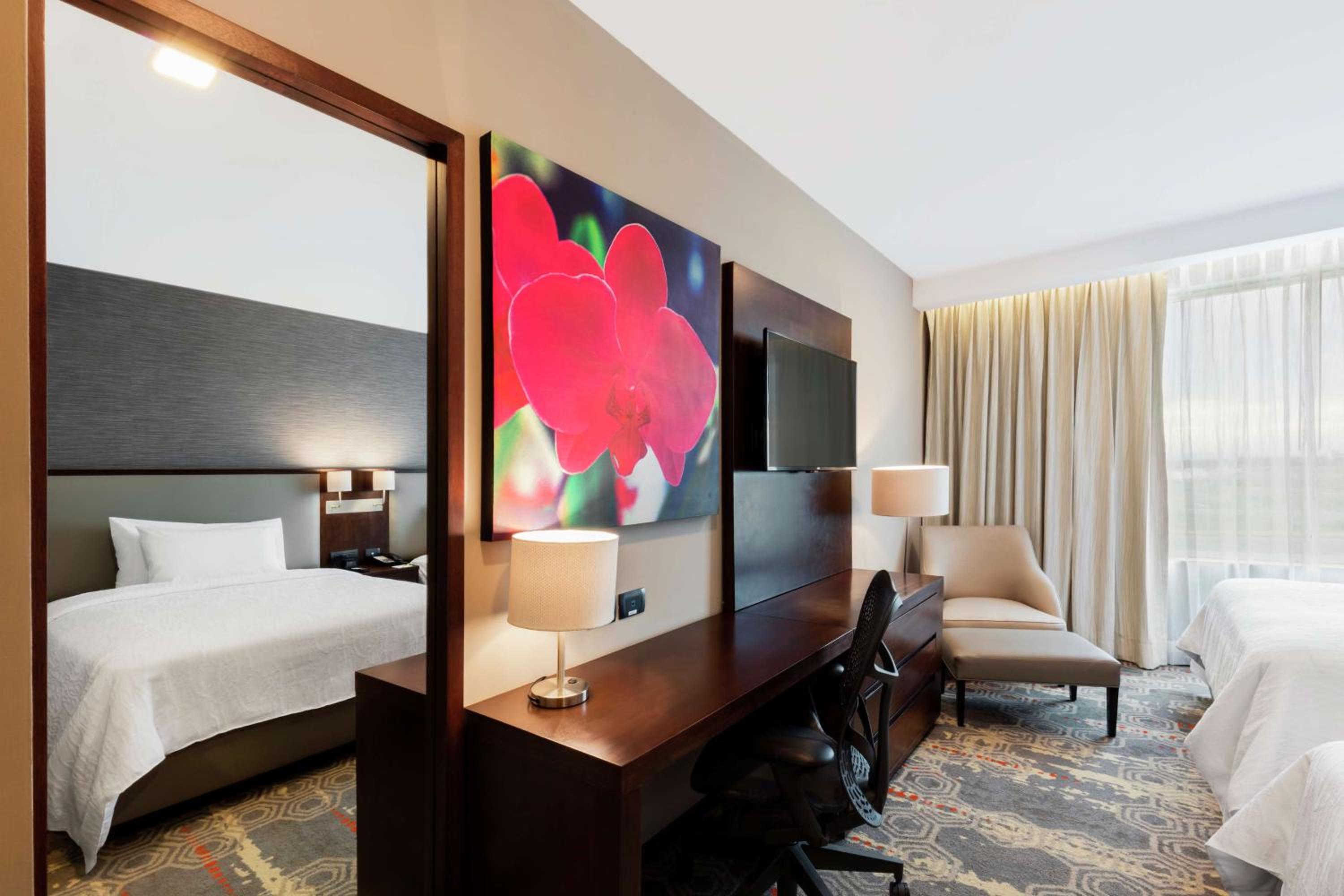 Deluxe Queen Room with Two Queen Beds and Balcony photo 3