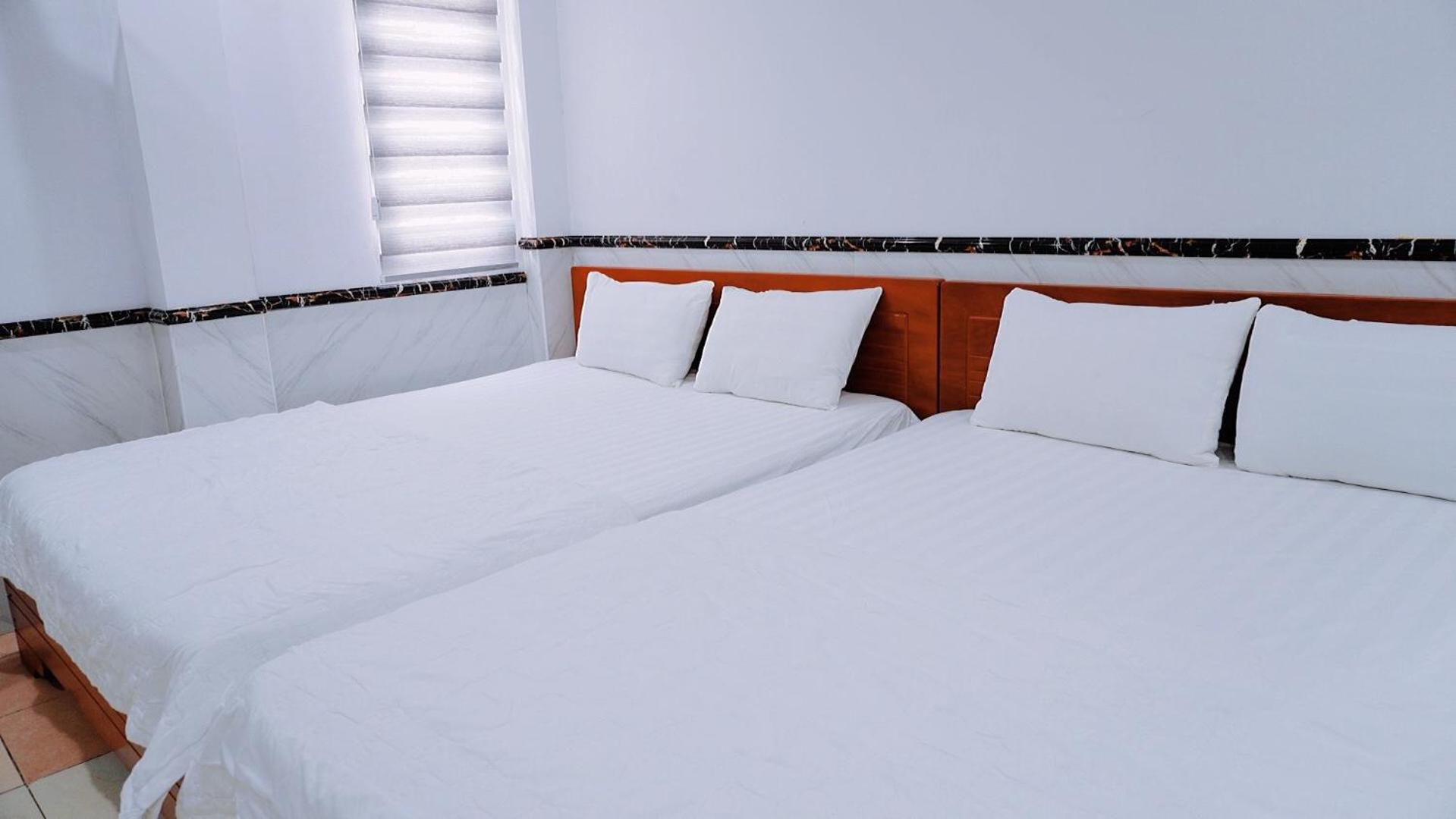 Standard Queen Room with Two Queen Beds photo 1