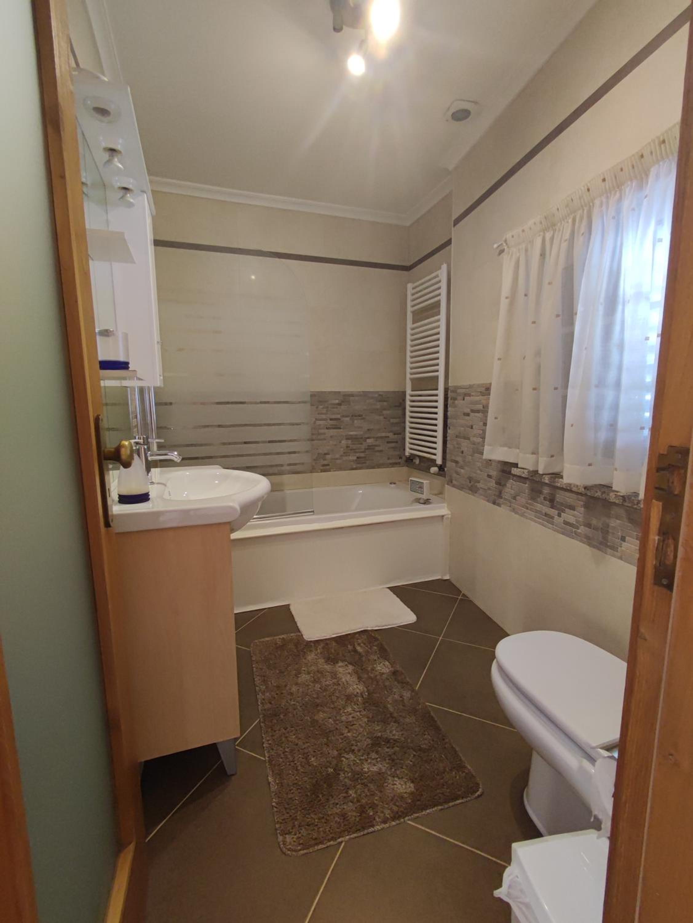 Three-Bedroom House - Photo 24