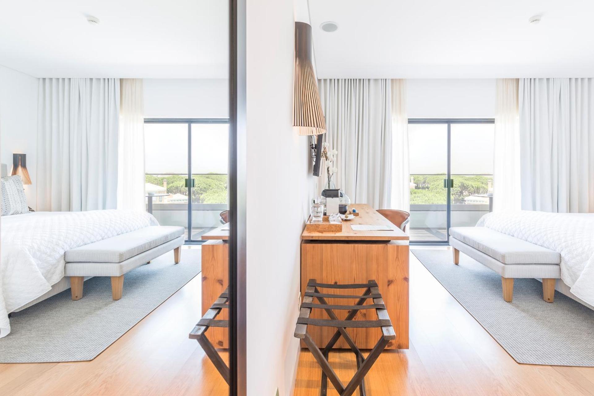 hotel room with two beds and a view of the ocean