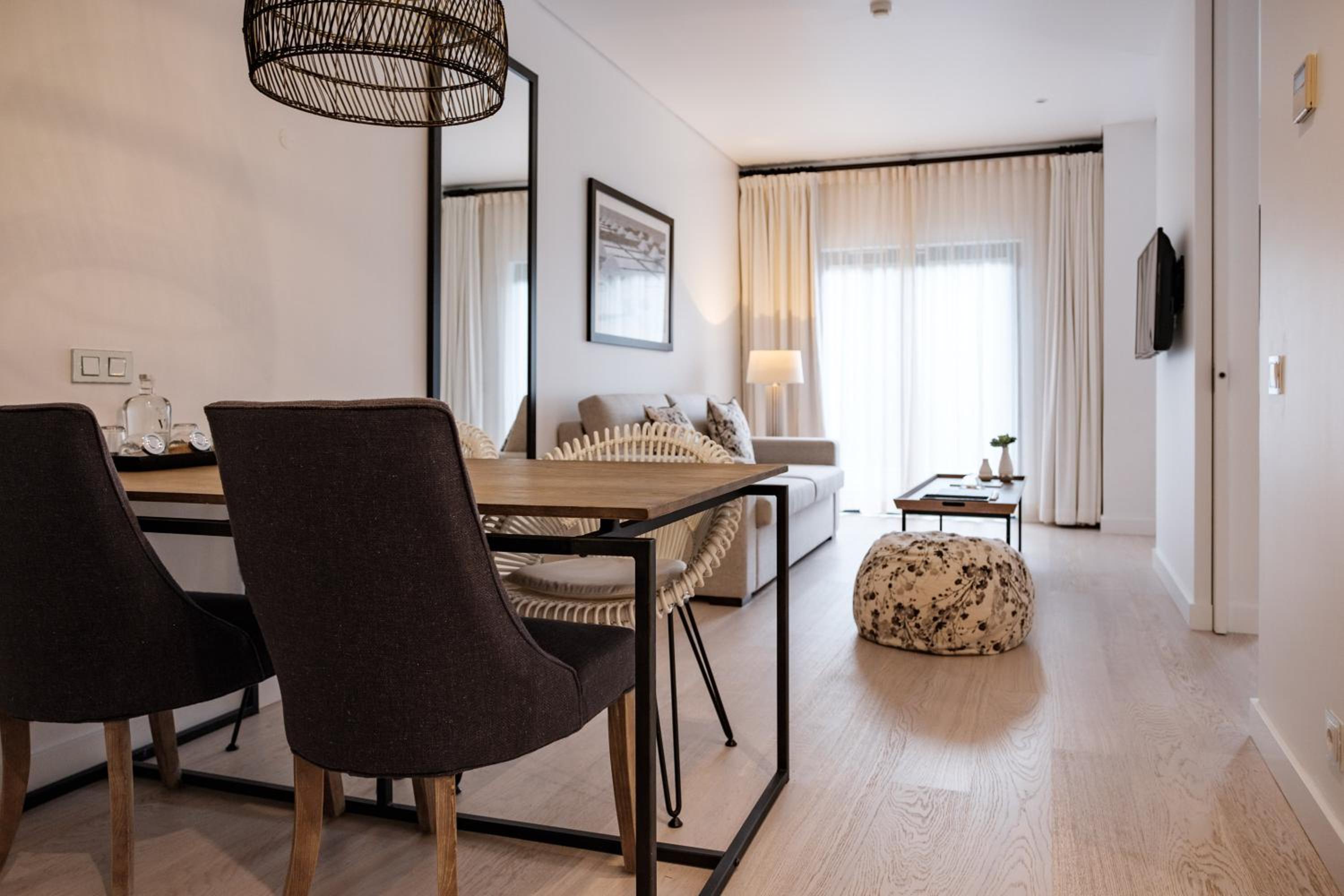 dining table and chairs in the middle of the room