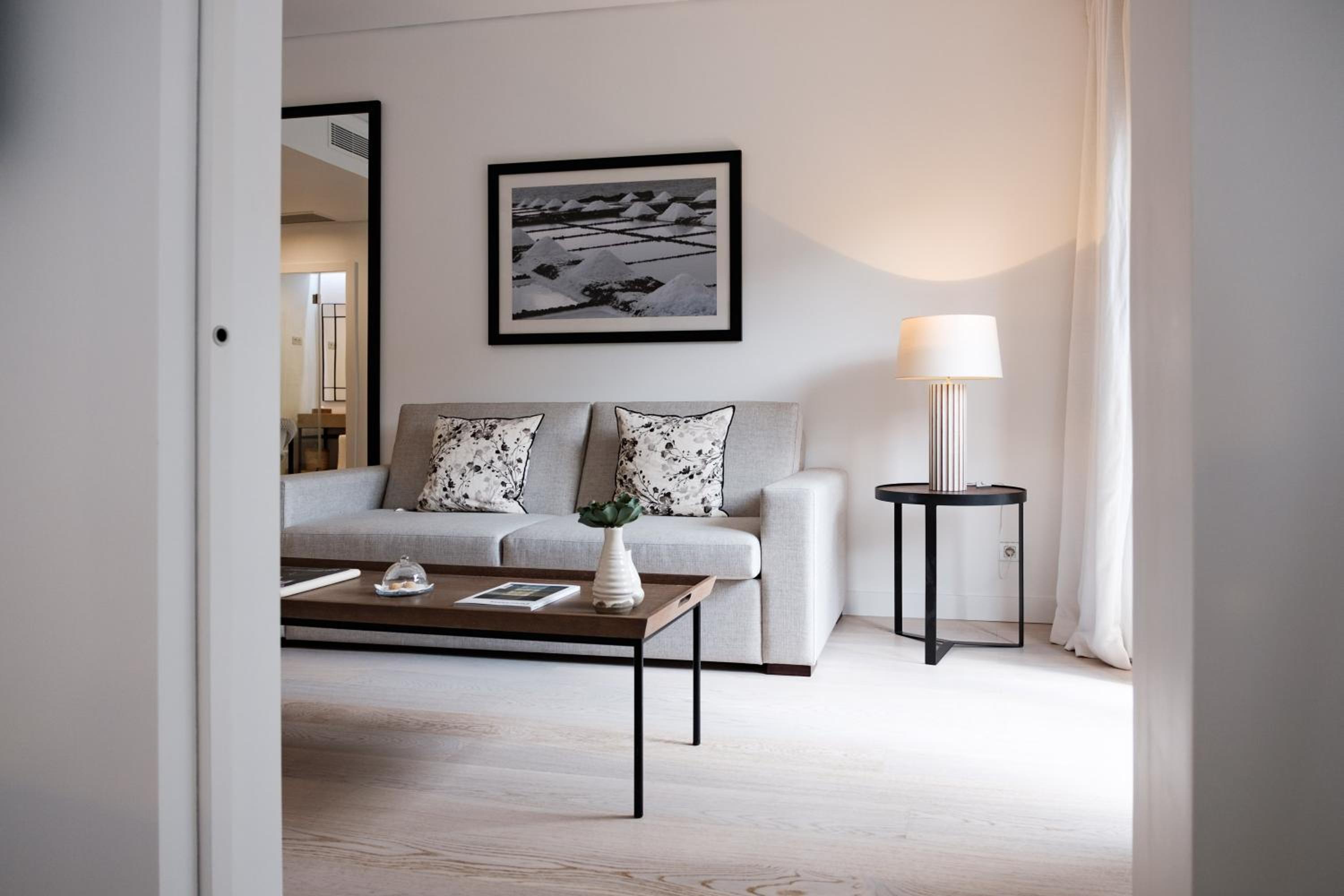 living room with a couch, coffee table and lamp