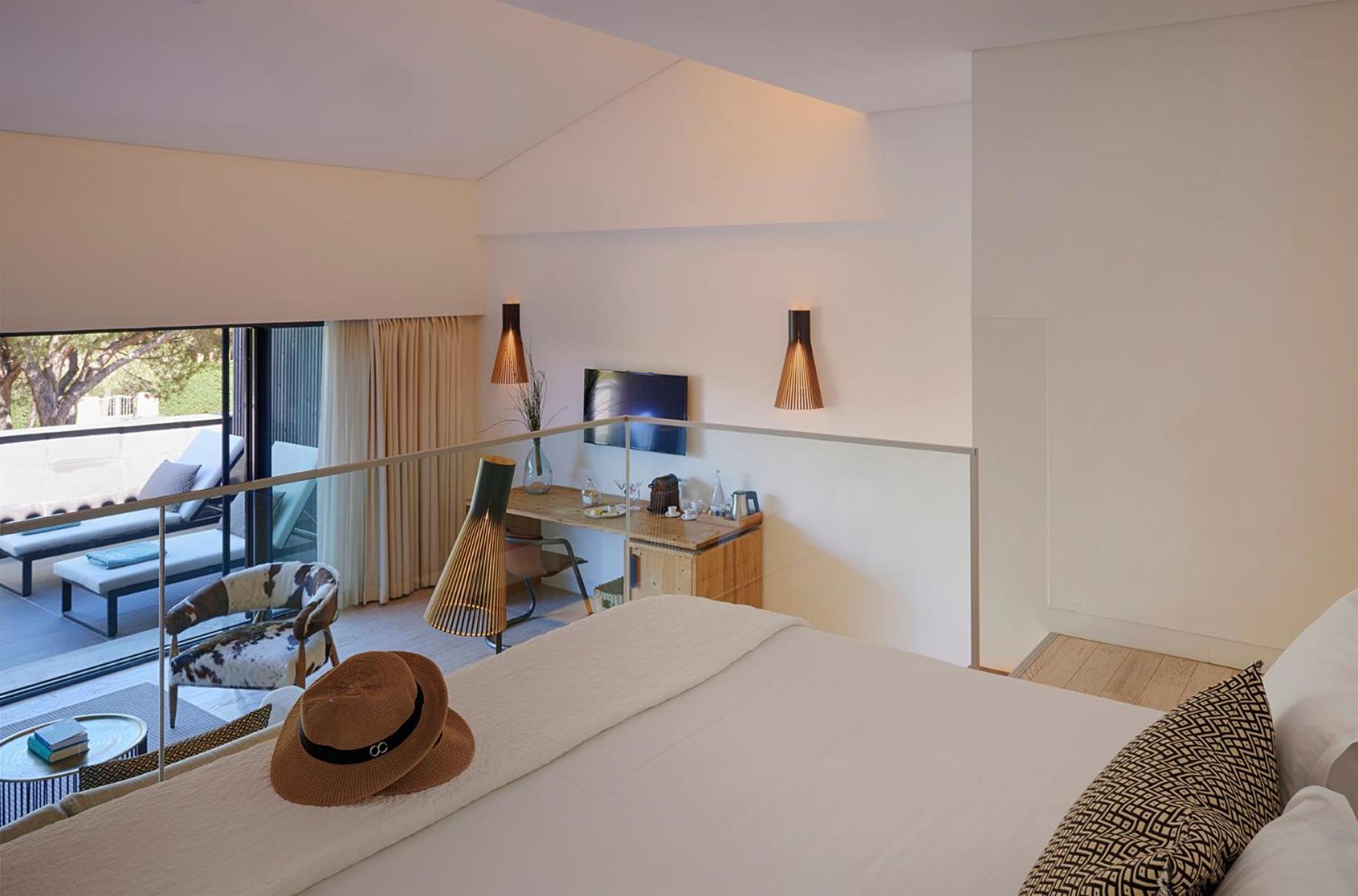hotel room with a view of the pool and patio