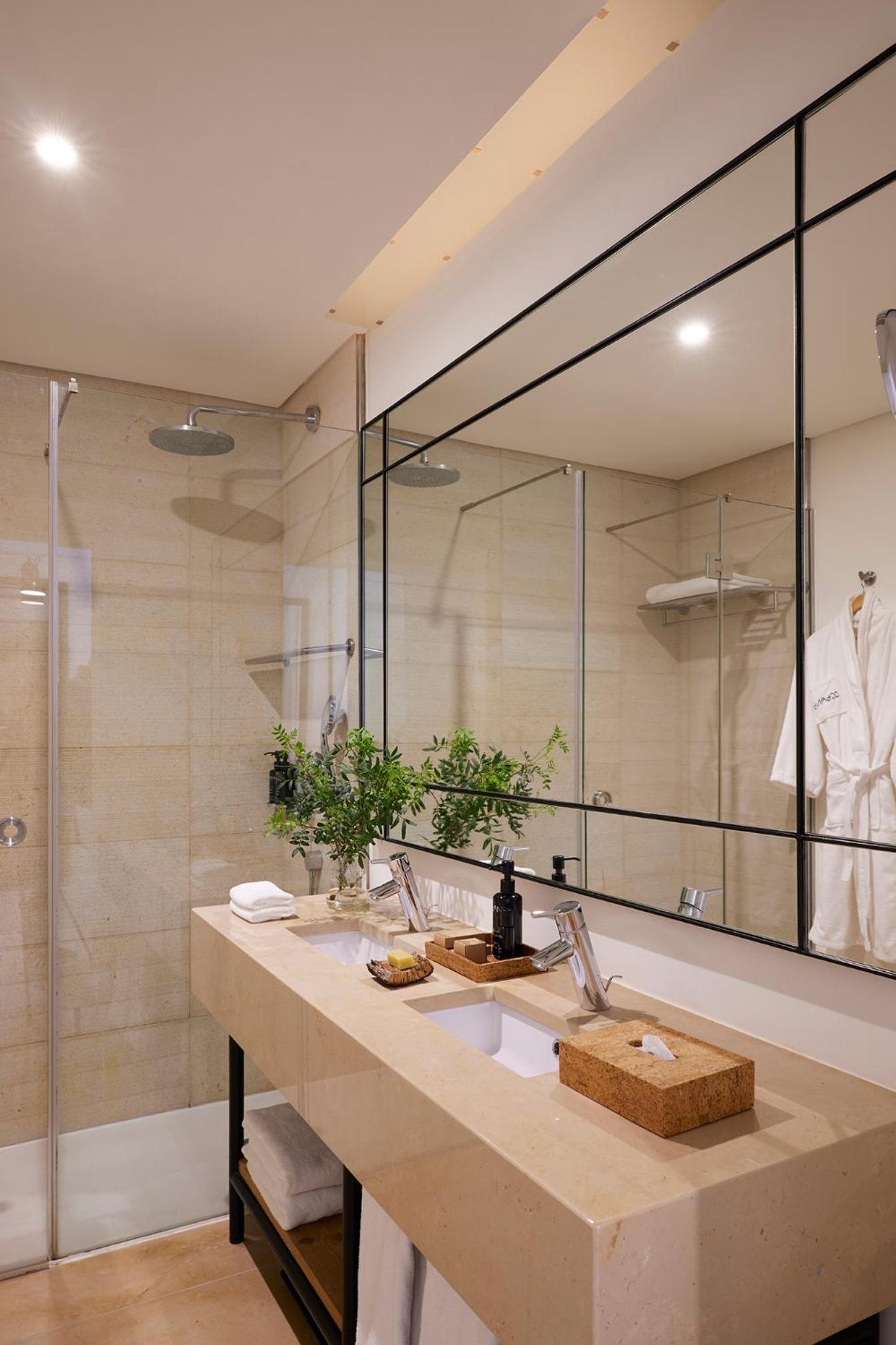 bathroom with a sink, shower, and bathtub